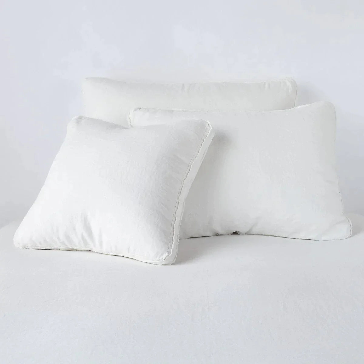 Winter White: Midweight linen shams in winter white colorway shown leaning upright on white background.