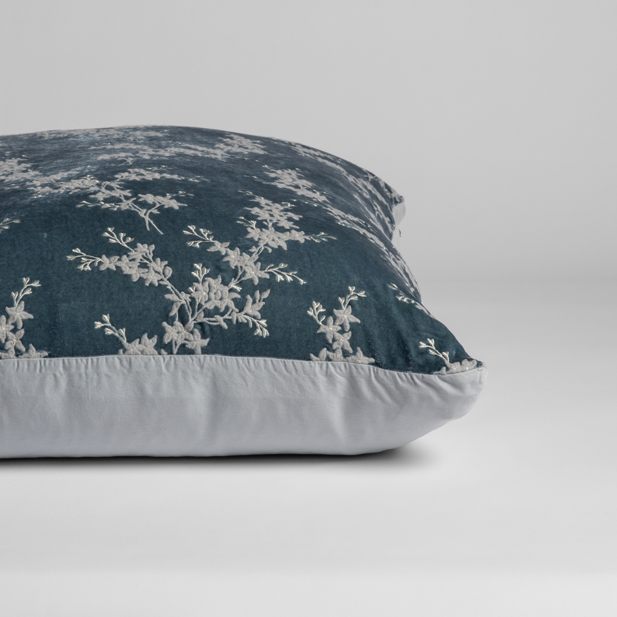 Mineral: A close-up of the sham shown on its side to display the embroidered silk velvet face and tencel back — shown against a white background.