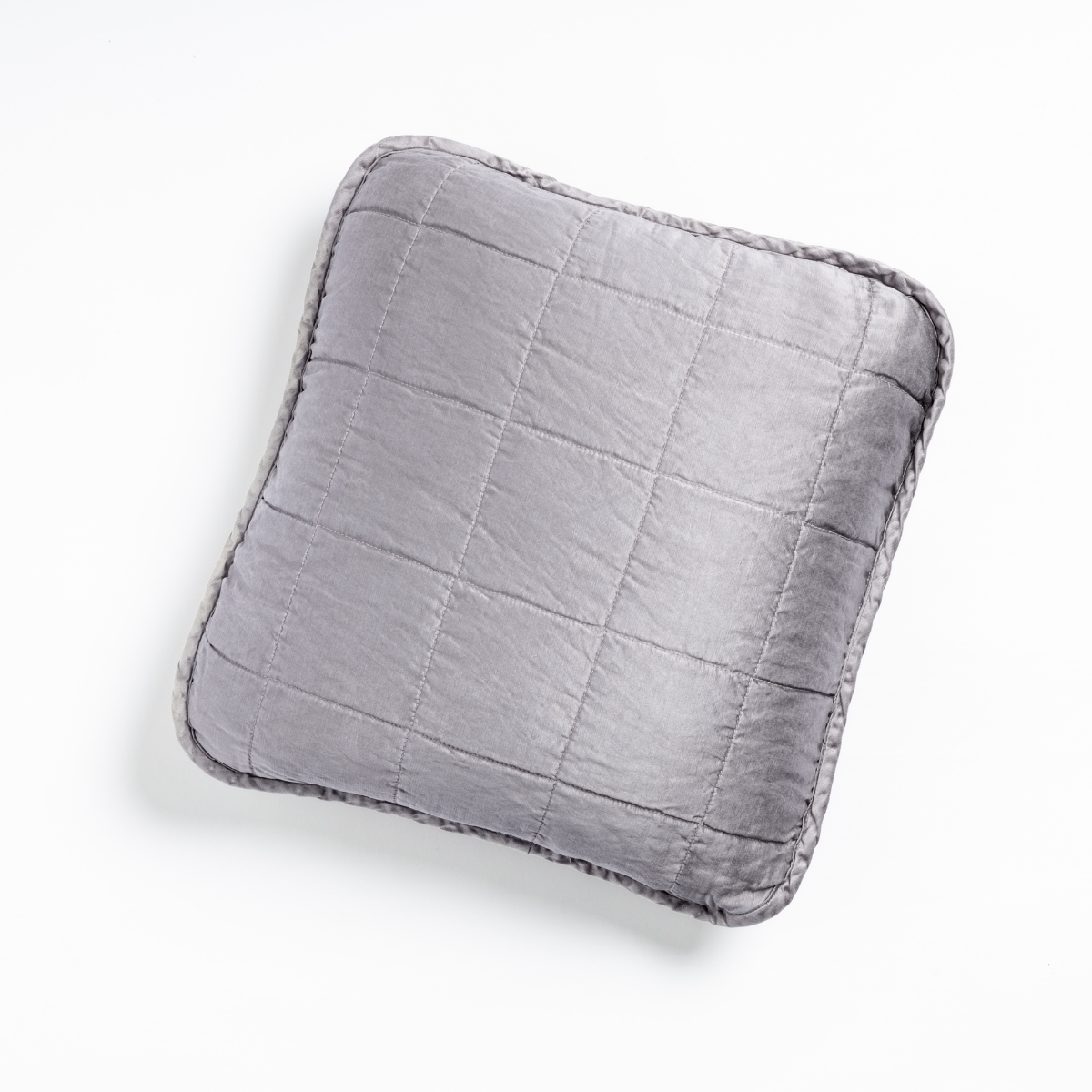 French Lavender: An overhead shot of a square-quilted square throw pillow in french lavender, a neutral violet tone, against a white background.