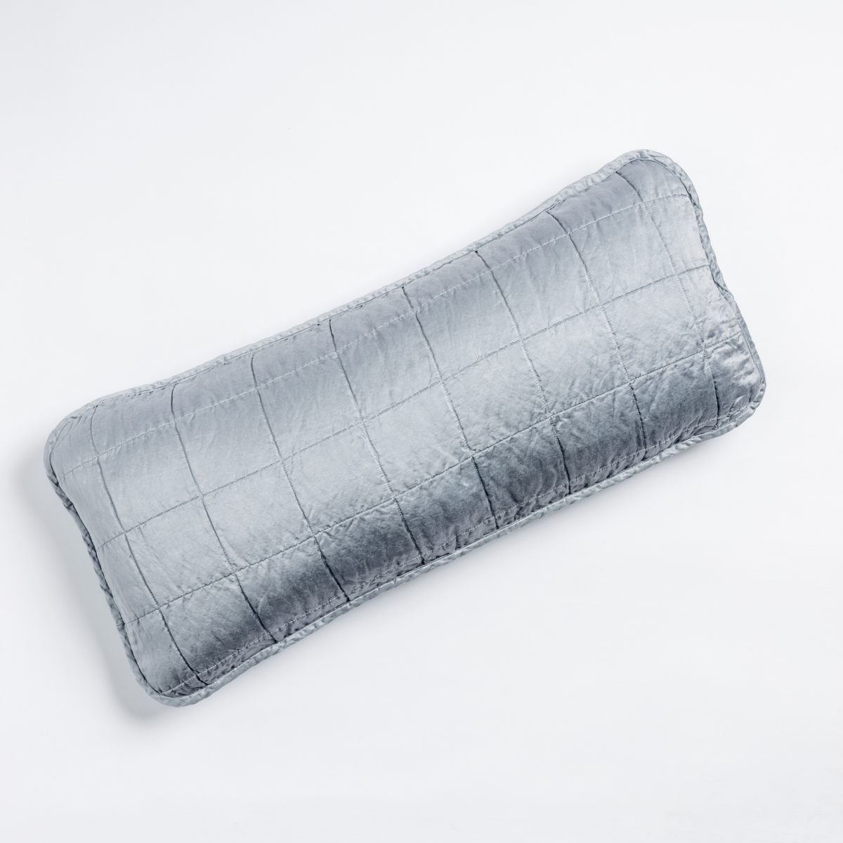 Tahoe Blue: An overhead shot of a square-quilted rectangle throw pillow in tahoe blue, a crisp true blue, against a white background.