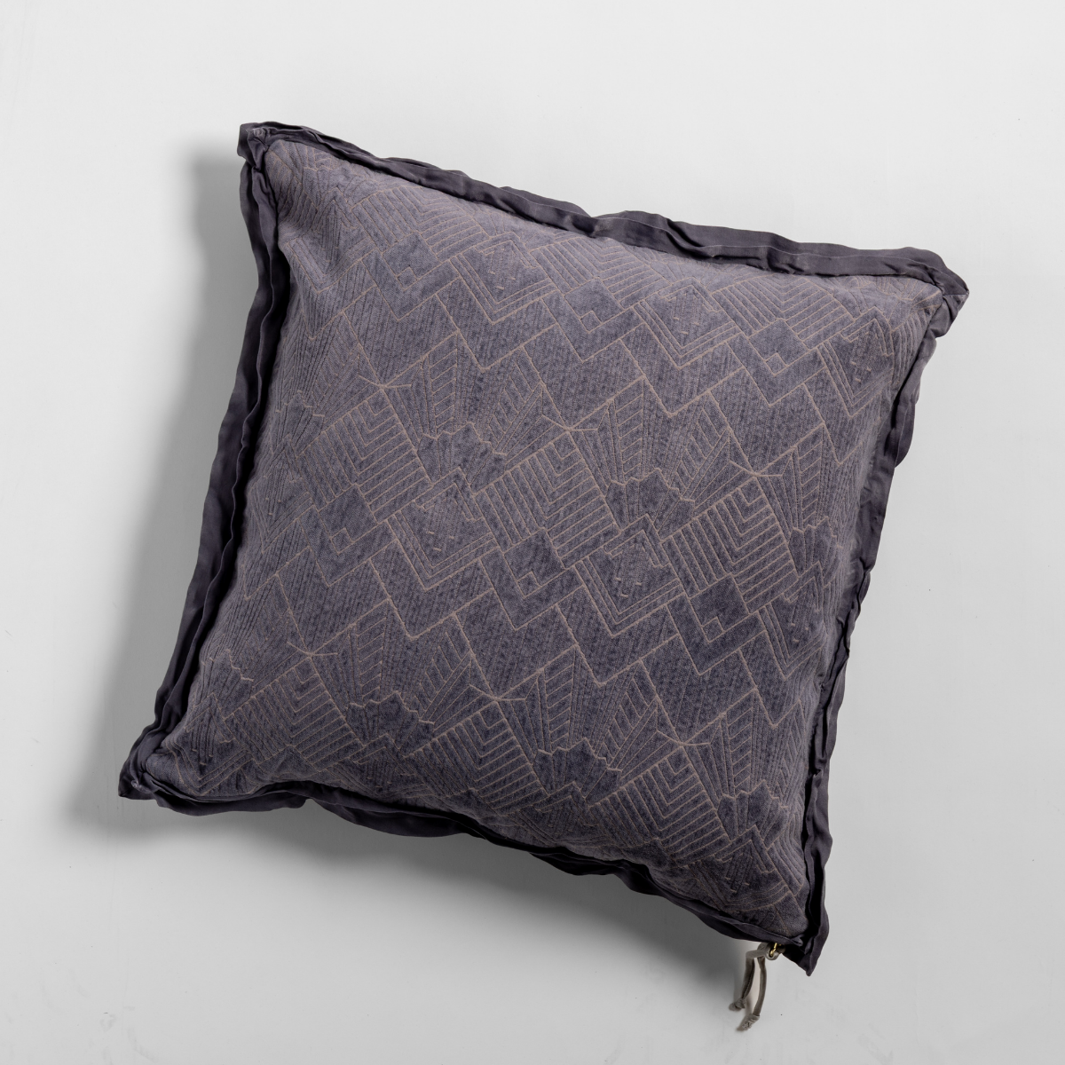 French Lavender: The chenille side of a textured throw pillow with contrasting ruffled edges, shot from overhead against a plain background.