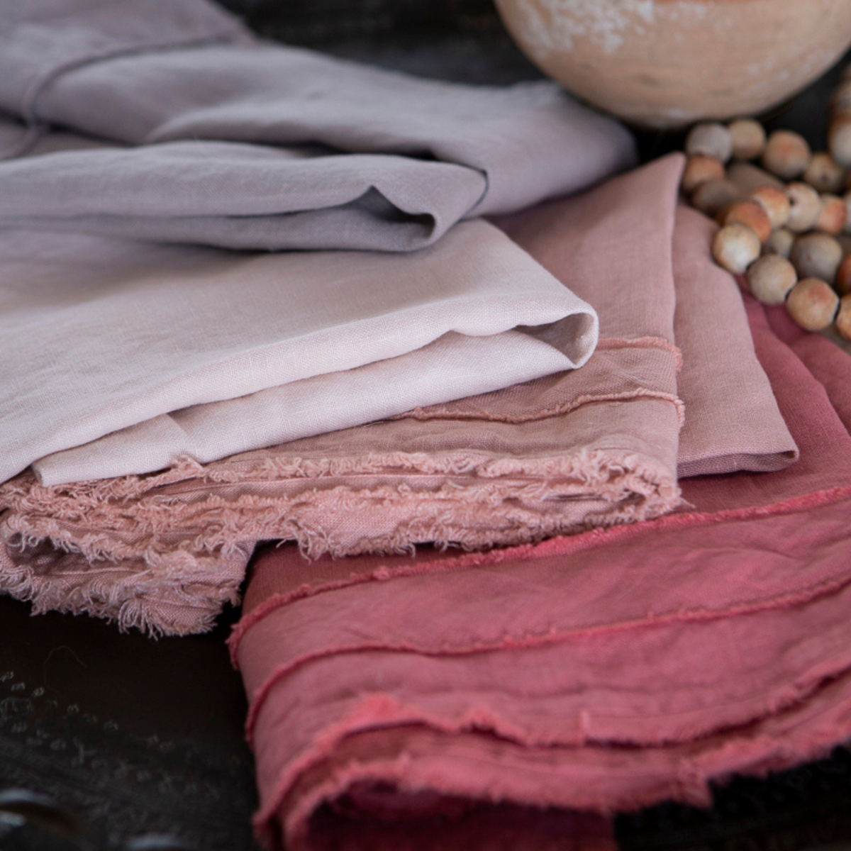 : a close up of the raw trim details on midweight linen guest towels.