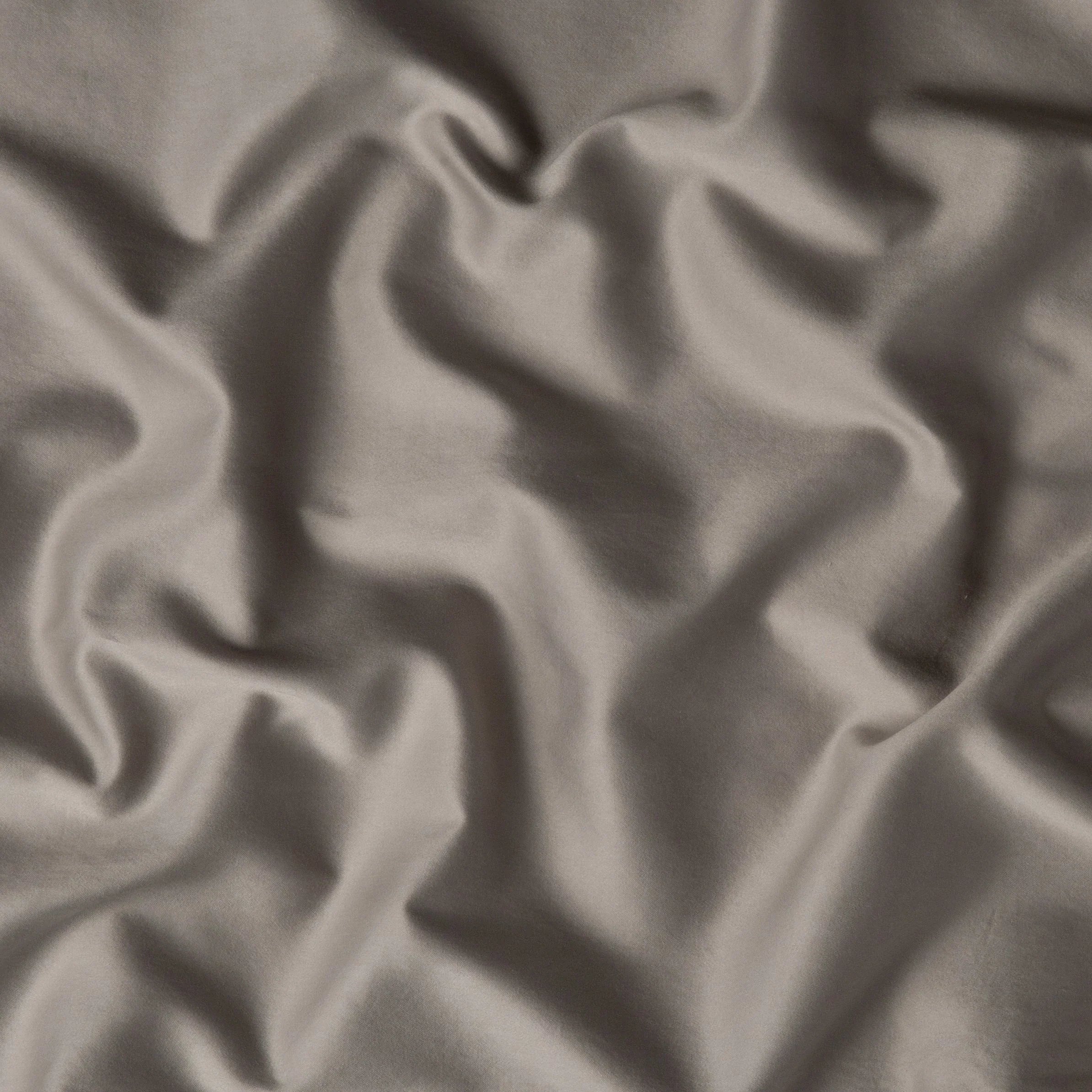 Fog: A close up of cotton sateen fabric in fog, a neutral-warm, soft mid-tone grey.