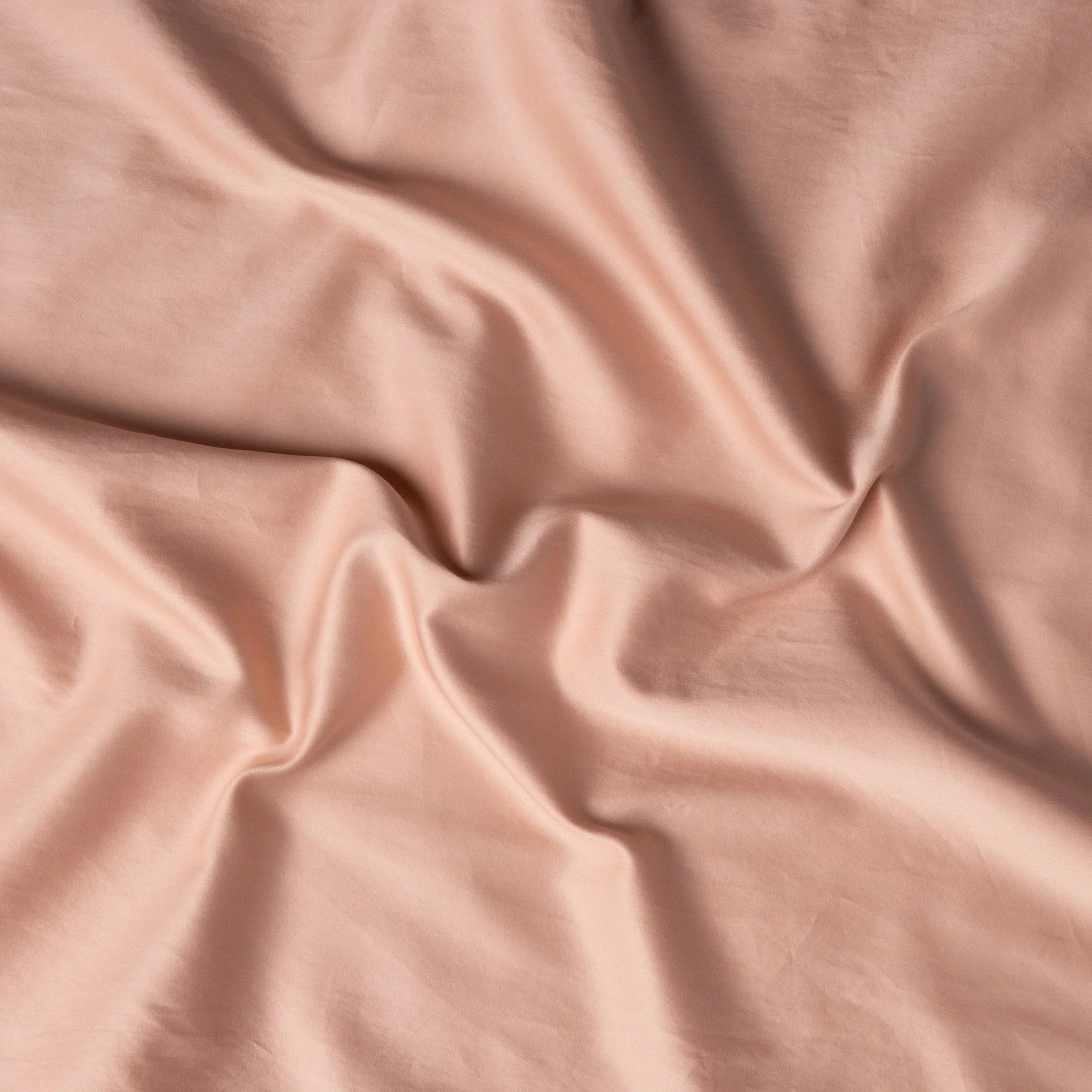 Rouge: A close up of cotton sateen fabric in rouge, a mid-tone blush pink.