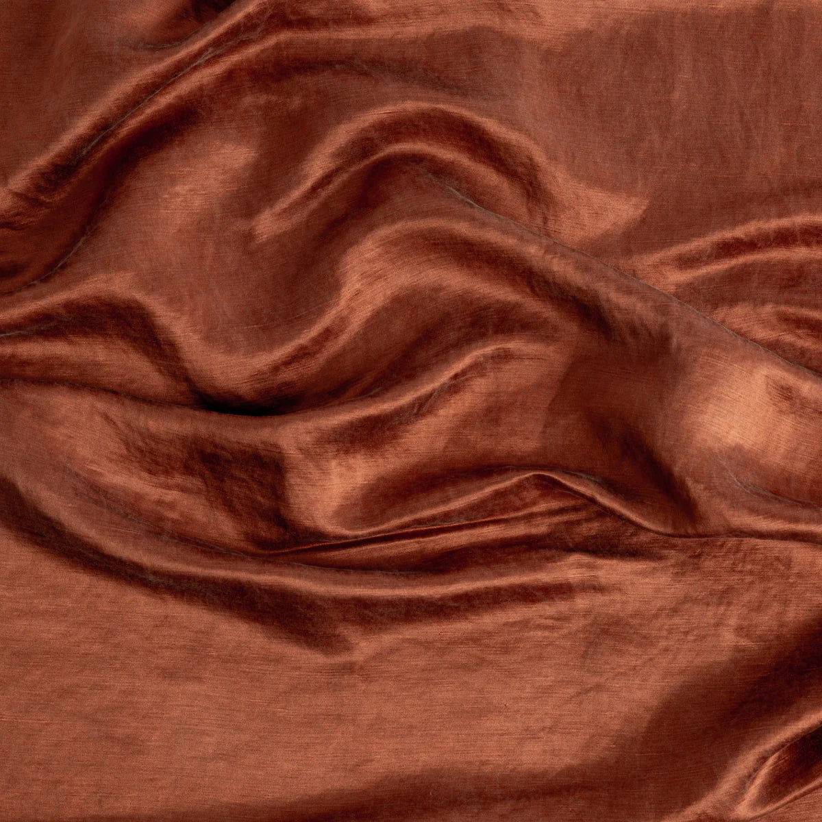 Autumn: Close-up of silk charmeuse in fig, a richly saturated persimmon color.