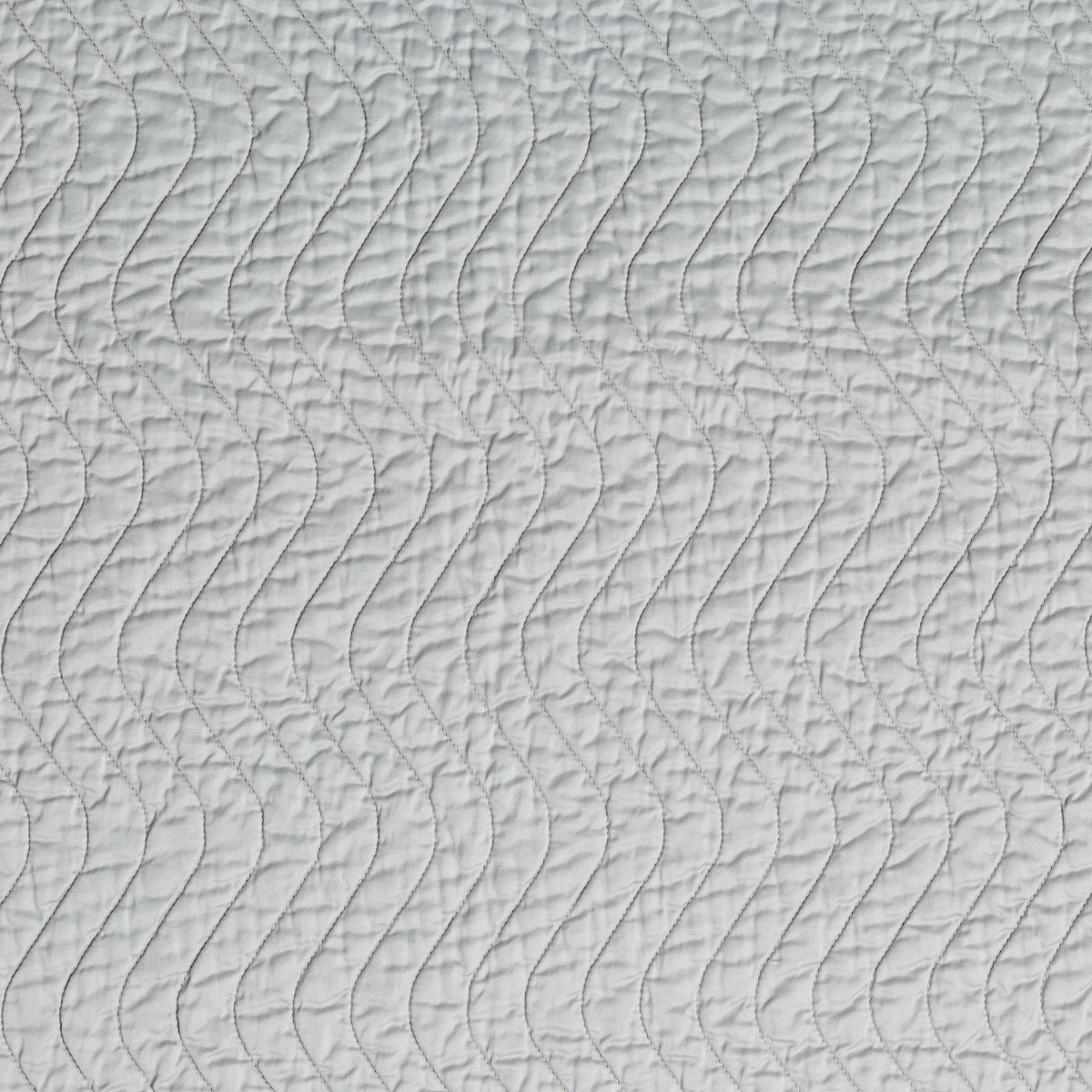 Cloud: A close up of quilted cotton sateen fabric in cloud, a soft, subtle sky blue-grey.