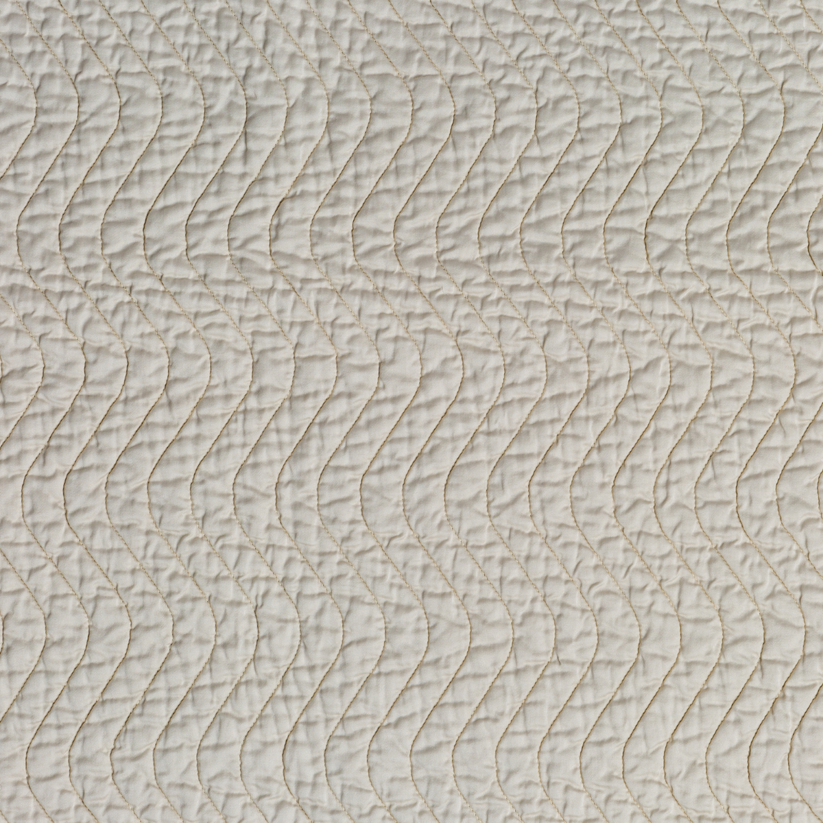 Parchment: A close up of quilted cotton sateen fabric in parchment, a warm, antiqued cream.