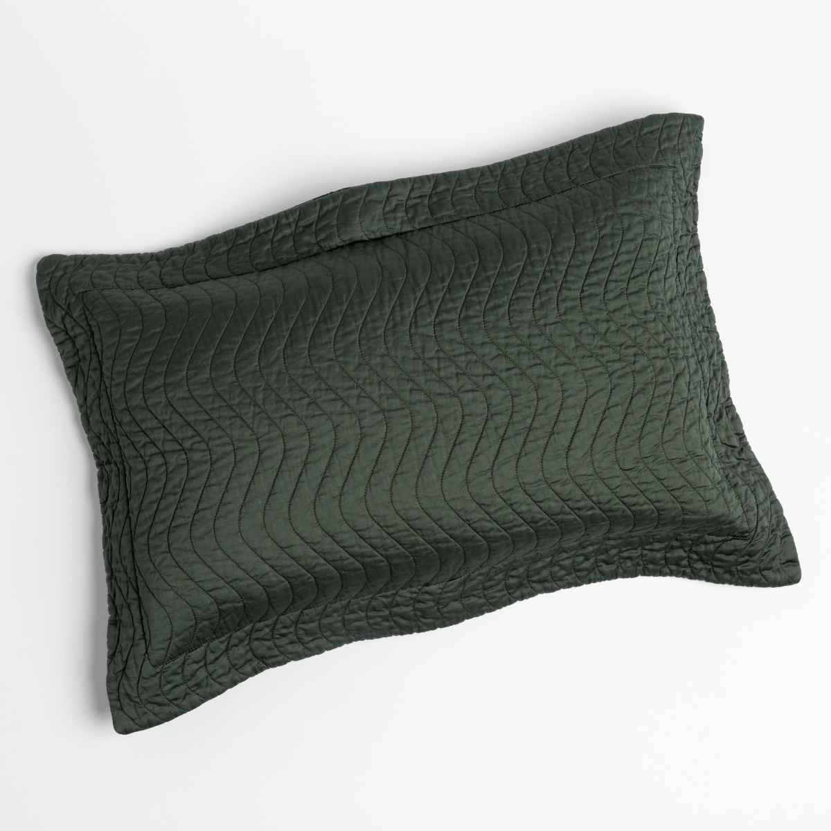 Juniper: 15x24 quilted cotton sateen throw pillow shot overhead against a white background.