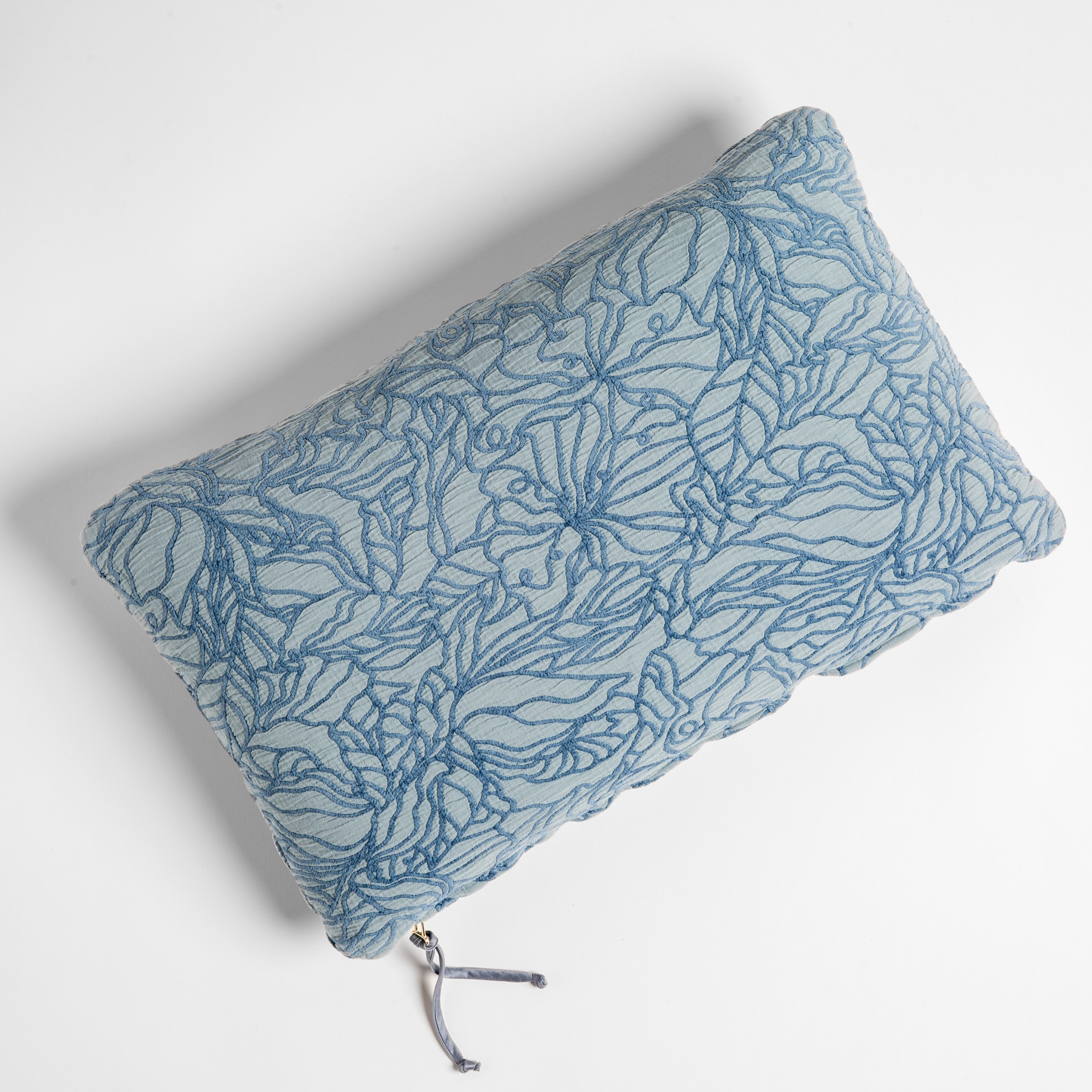 Tahoe Blue: cotton jacquard side of a rectangle throw pillow shown from overhead against a white background.
