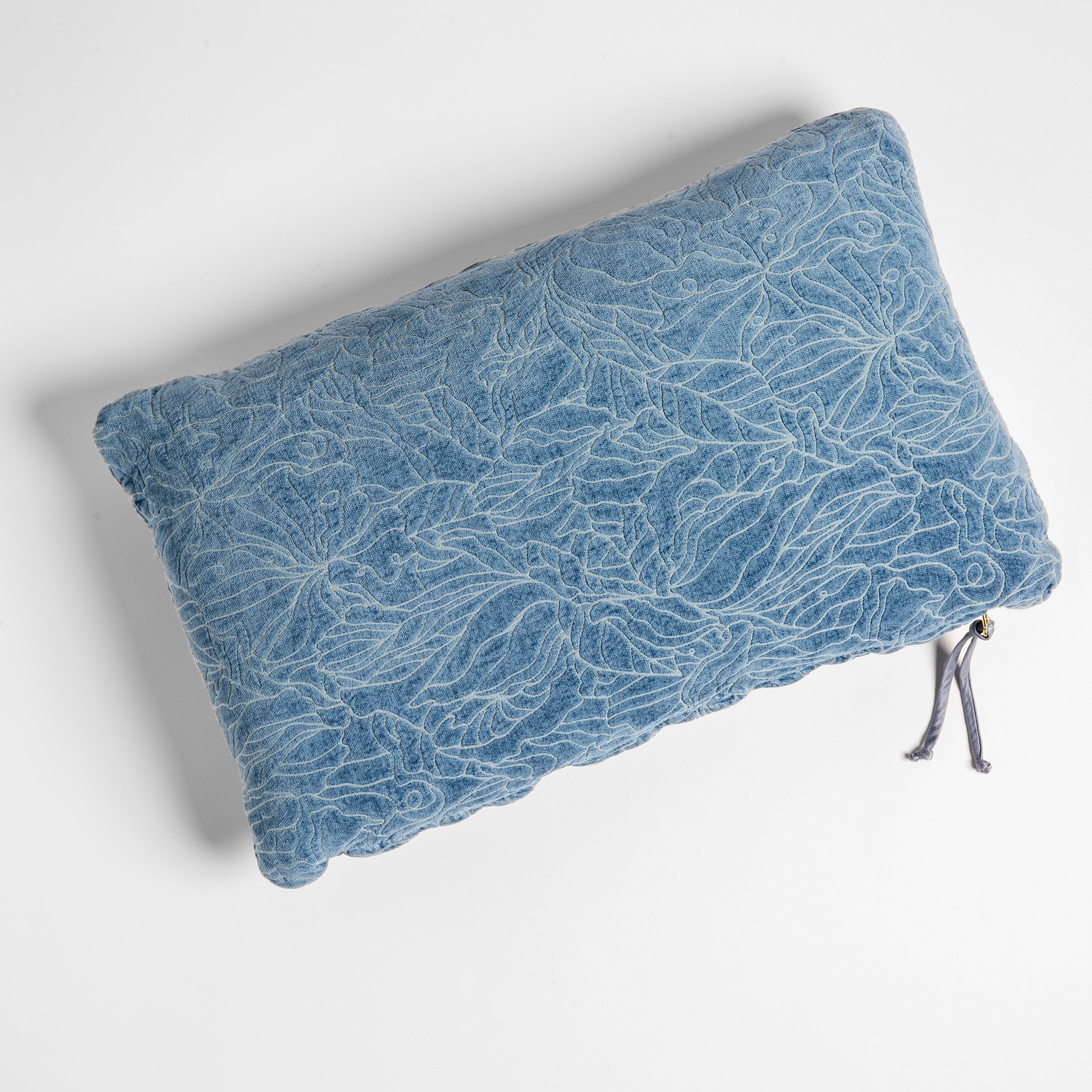 Tahoe Blue: chenille jacquard side of a rectangle throw pillow shown from overhead against a white background.