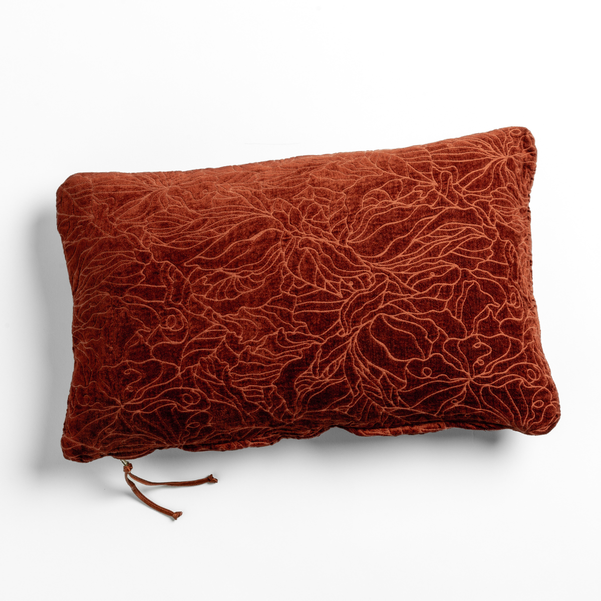 Autumn: A close-up of a chenille jacquard side of a Georgia Throw Pillow in Autumn, a rich terracotta tone, shown against a white background.