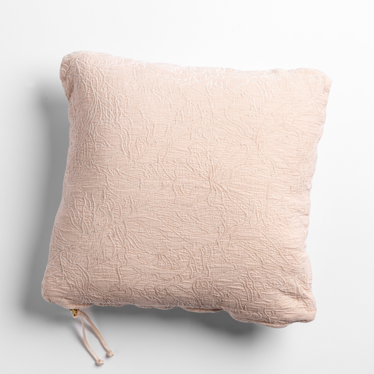 Pearl: cotton jacquard side of a georgia square cushion shown from overhead against a white background.