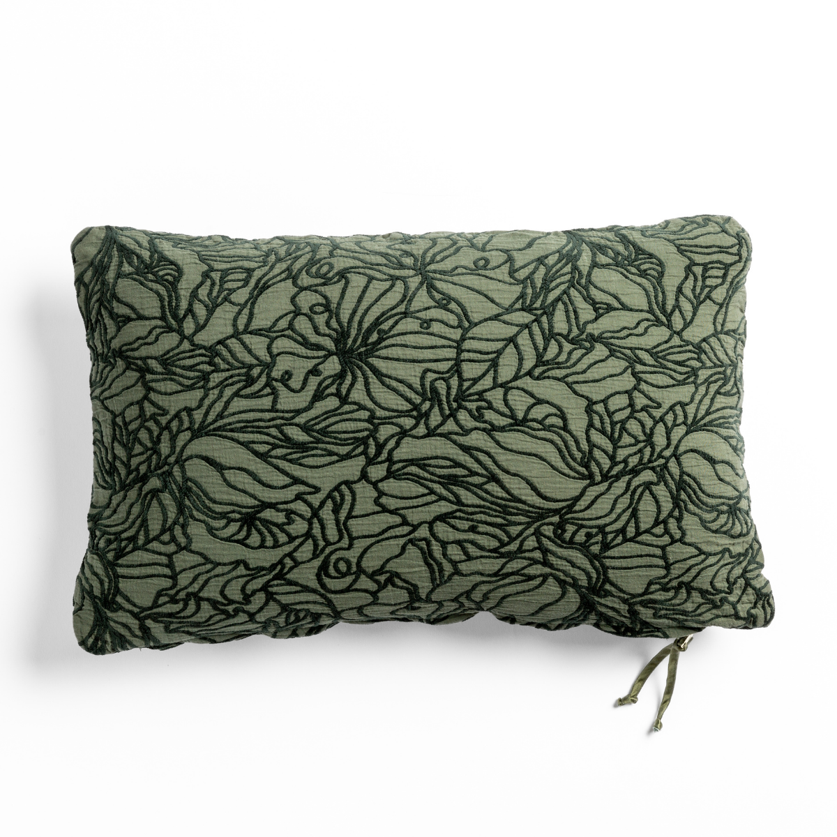 Juniper: cotton jacquard side of a rectangle throw pillow shown from overhead against a white background.