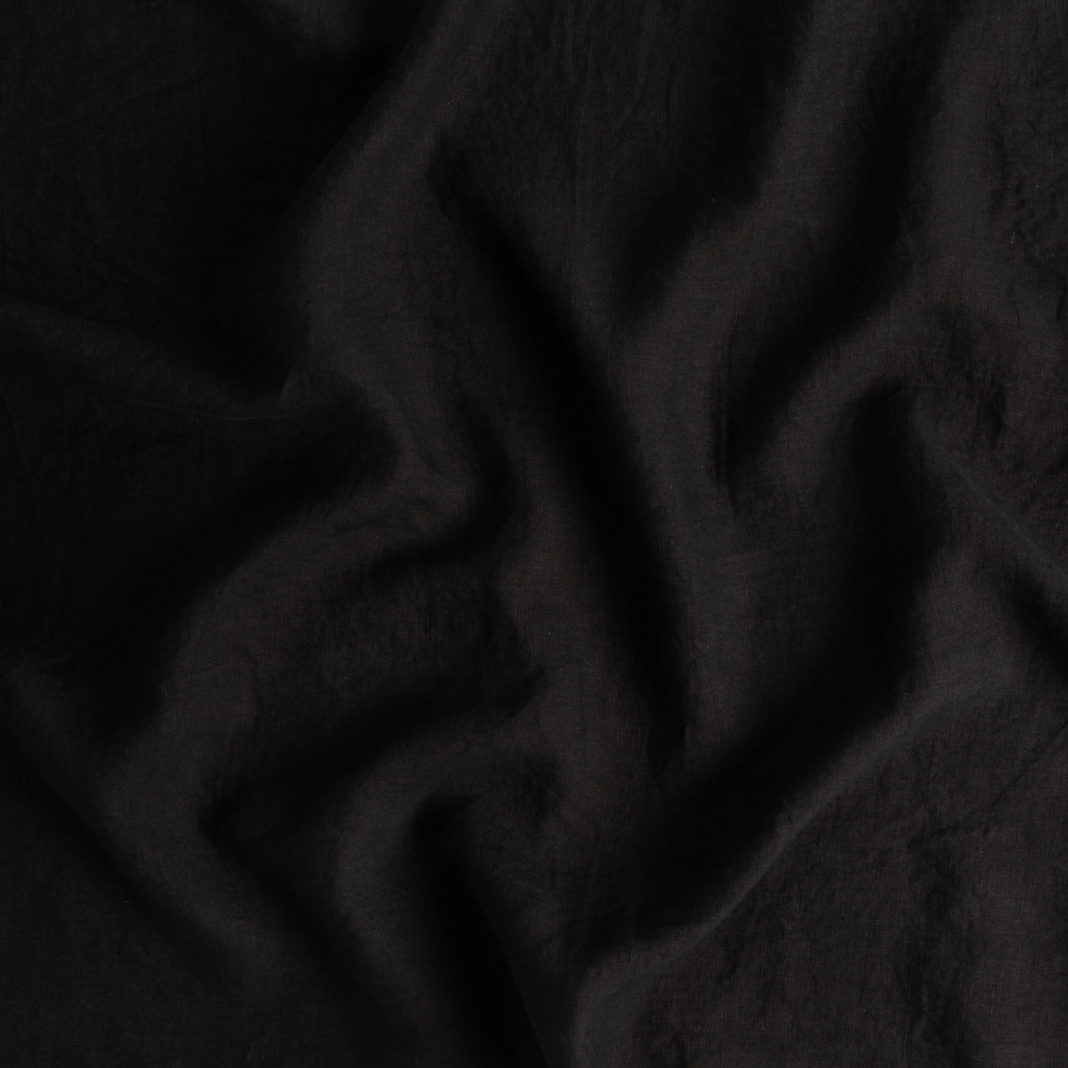 Corvino: a close-up of signature linen in corvino, a black tone.