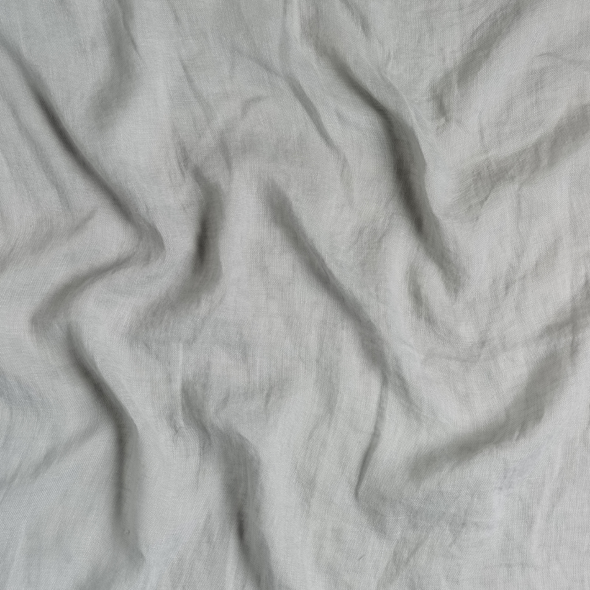 Mineral: A close up of linen whisper fabric in mineral, a soothing seafoam blue with subtle grey-green undertones.