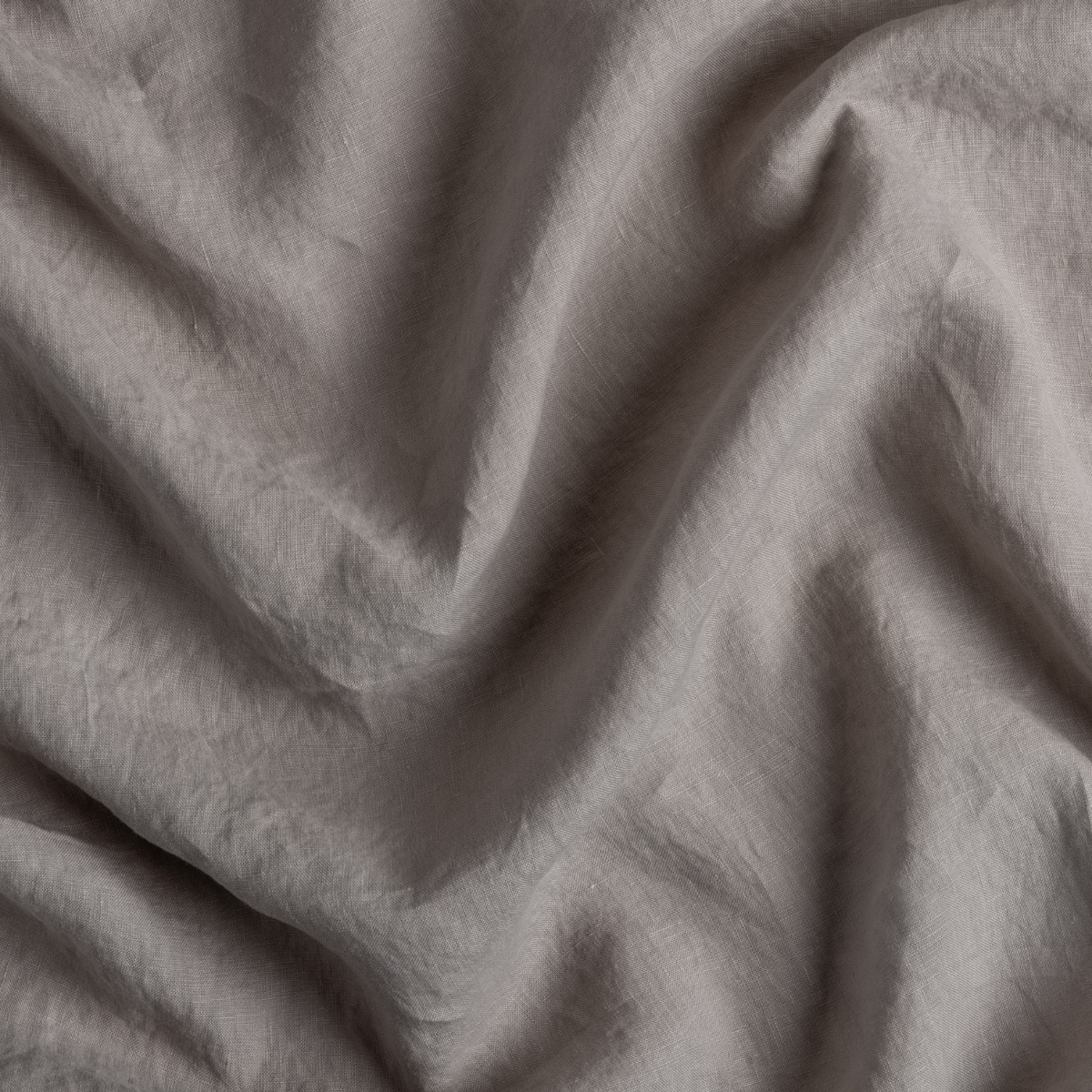 Fog: A close up of linen fabric in fog, a neutral-warm, soft mid-tone grey.