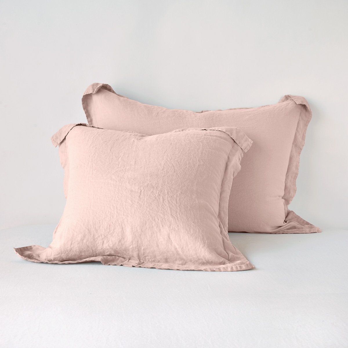 Rouge: Two shams leaning upright against a white background.