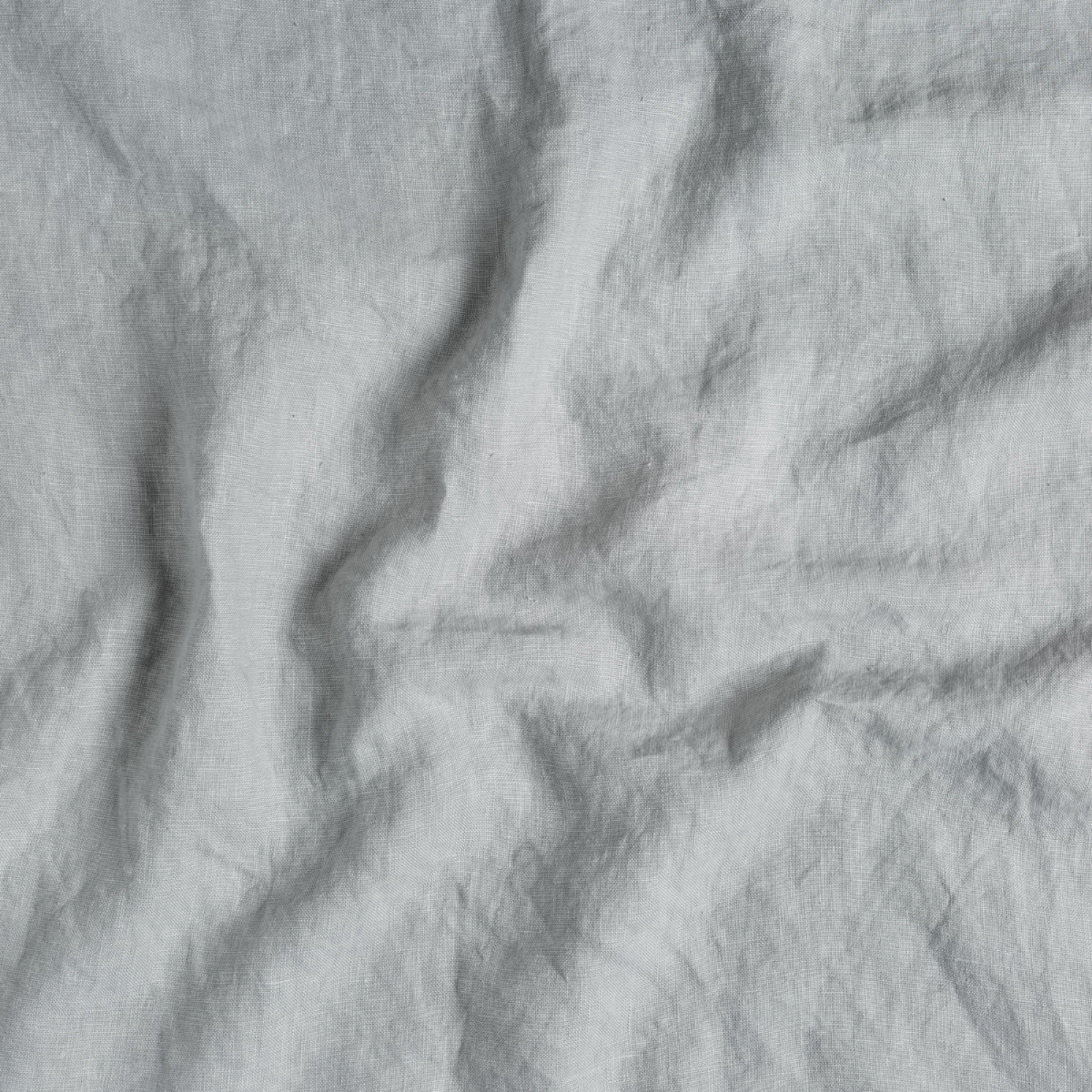 Cloud: A close up of midweight linen fabric in cloud, a soft, subtle sky blue-grey.