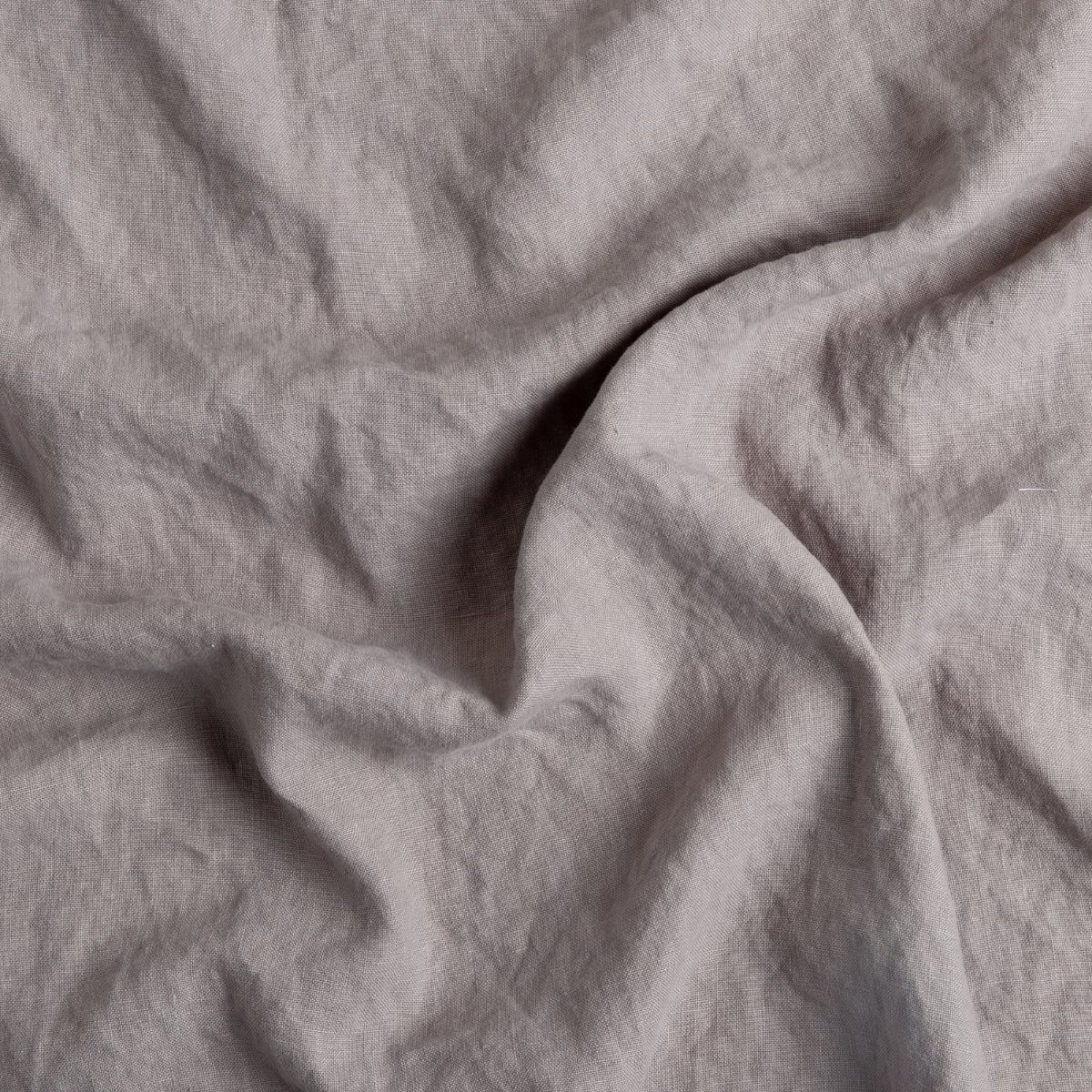 Moonlight: A close up of midweight linen fabric in moonlight, a saturated, cool, mid-dark grey tone.