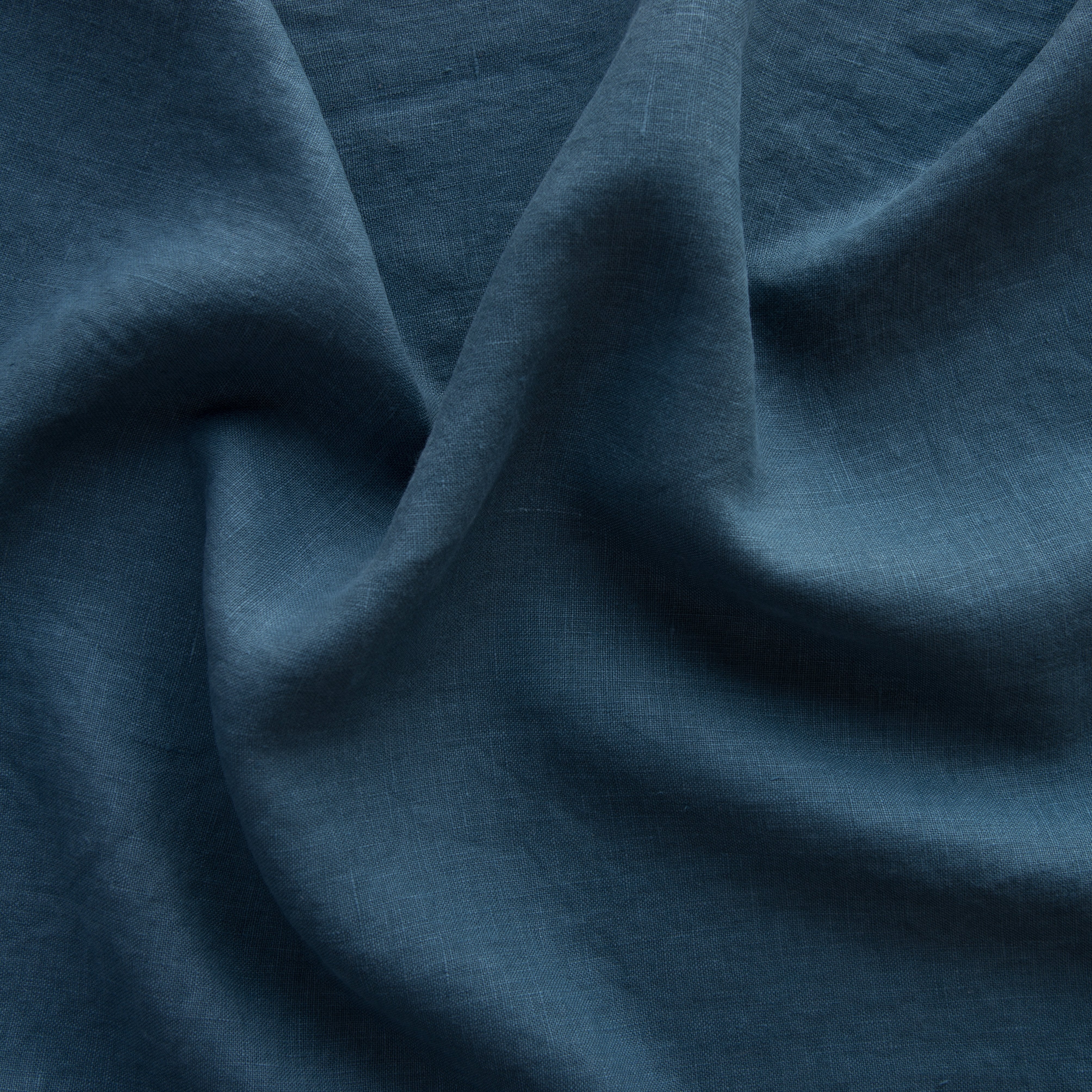 Midnight: A close up of midweight linen in midnight, a rich indigo tone.