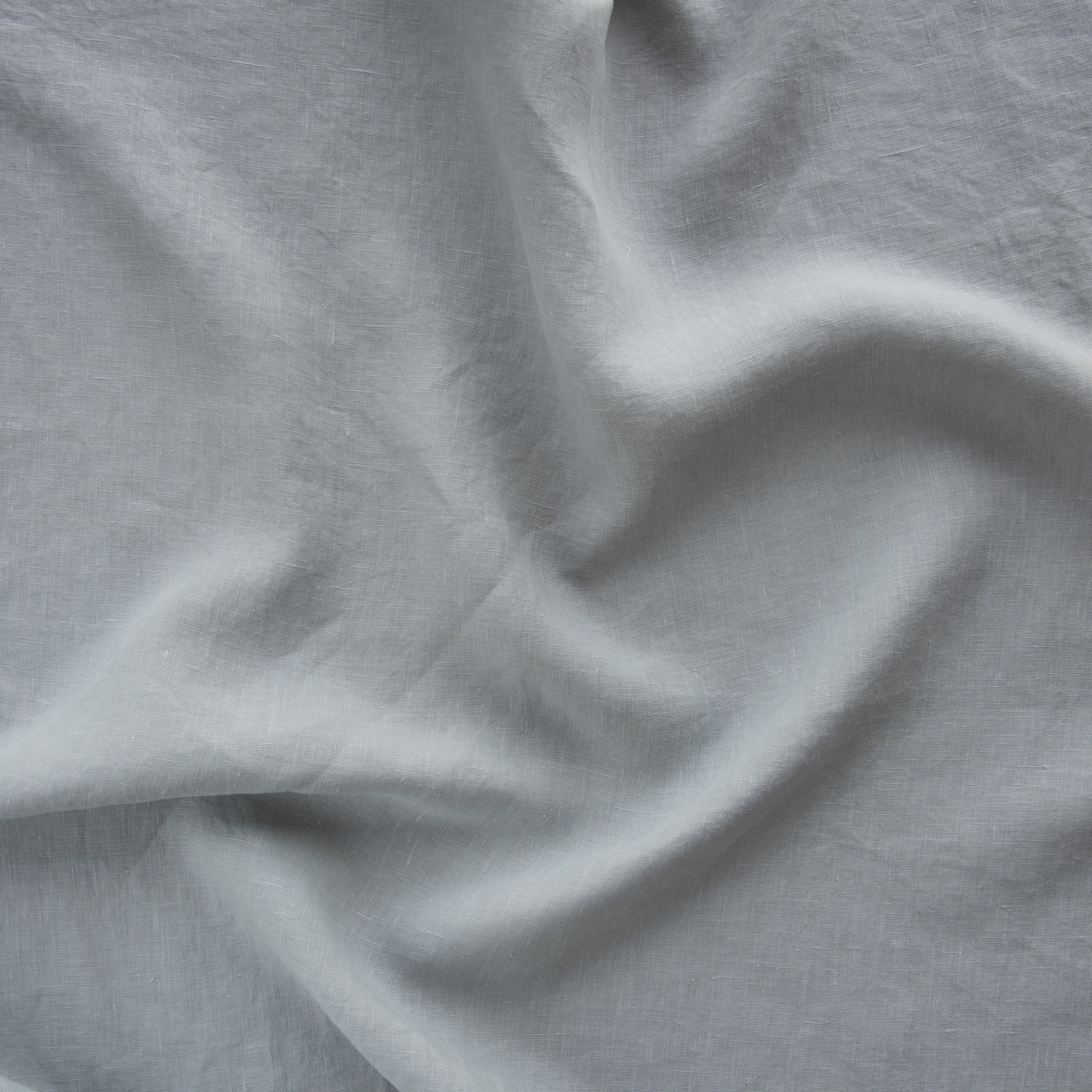 Mineral: A close up of midweight linen in mineral, a soothing seafoam blue with subtle grey-green undertones.