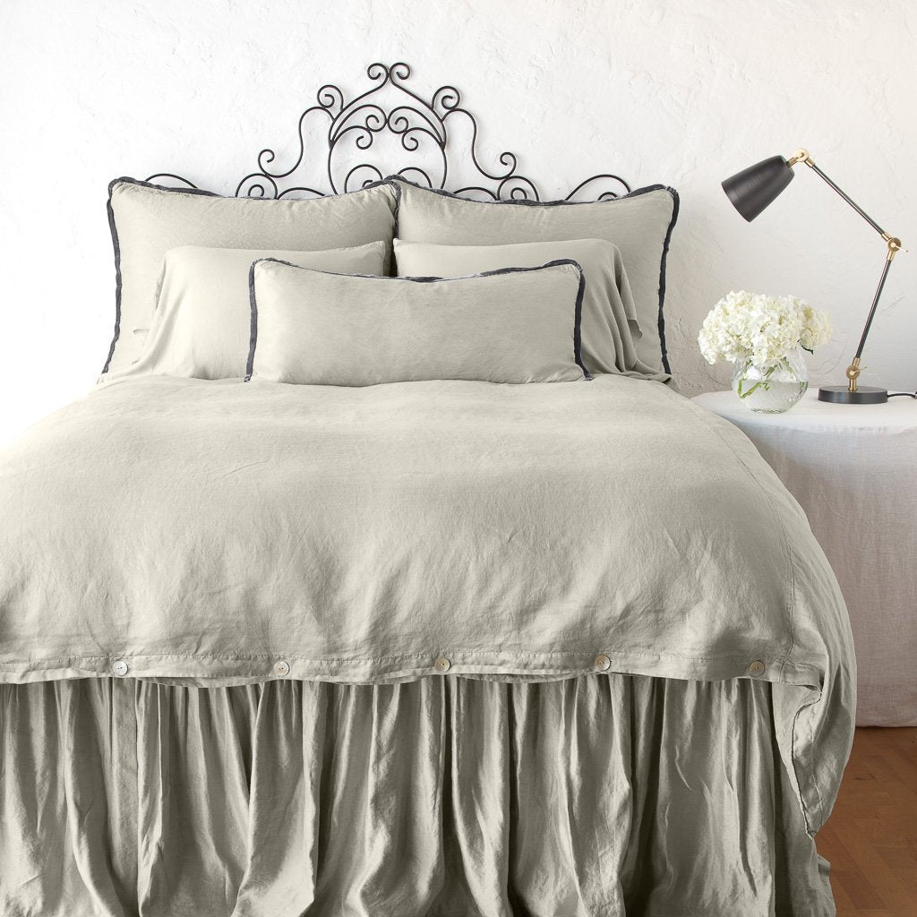 Fog: duvet cover with matching pillows and bed skirt - end of bed view.