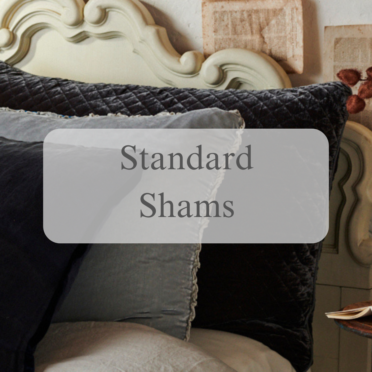 A shot of shams and pillows in light and dark grey tones with a text overlay that reads Standard Shams