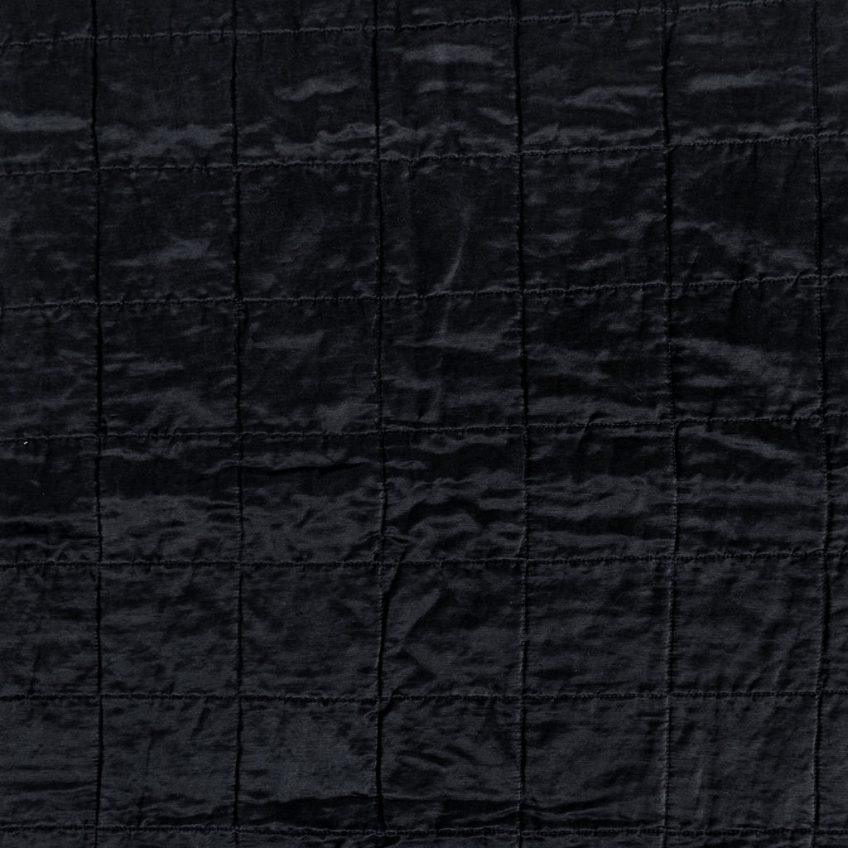 Corvino: a shot of square-quilted charmeuse in corvino, our classic black.