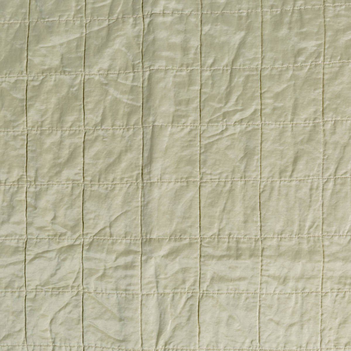 Parchment: a shot of square-quilted charmeuse in parchment, a warm antiqued cream