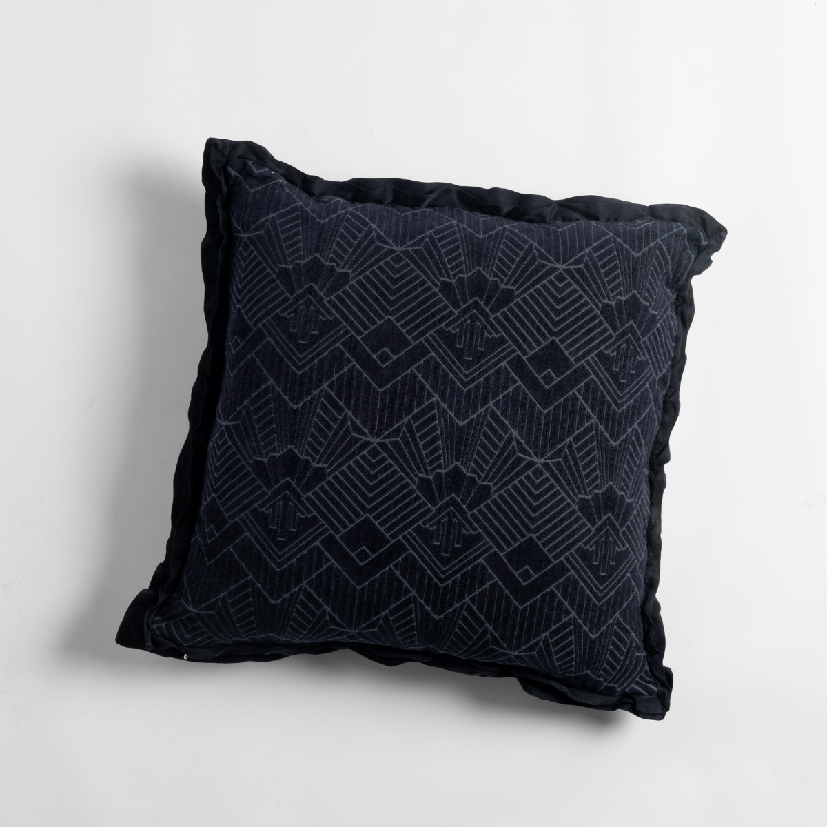 Slate: an overhead shot of a trettino throw pillow against a white background.