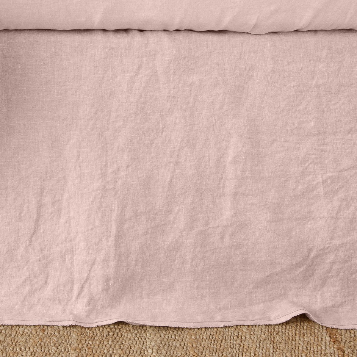 Rouge: Close up of the Austin bed skirt in rouge, highlighting its tailored, ungathered style.