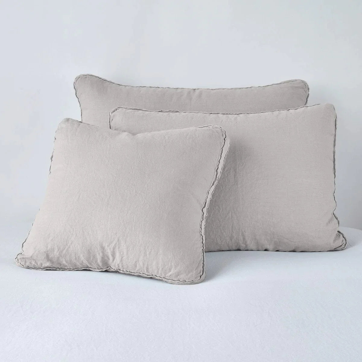 Fog: Midweight linen shams in fog colorway shown leaning upright on white background.