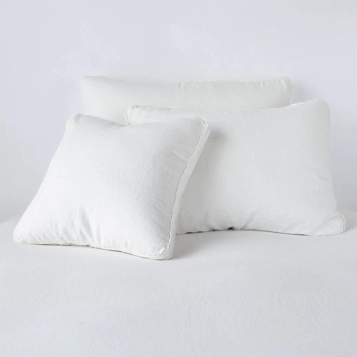Winter White: Midweight linen shams in winter white colorway shown leaning upright on white background.