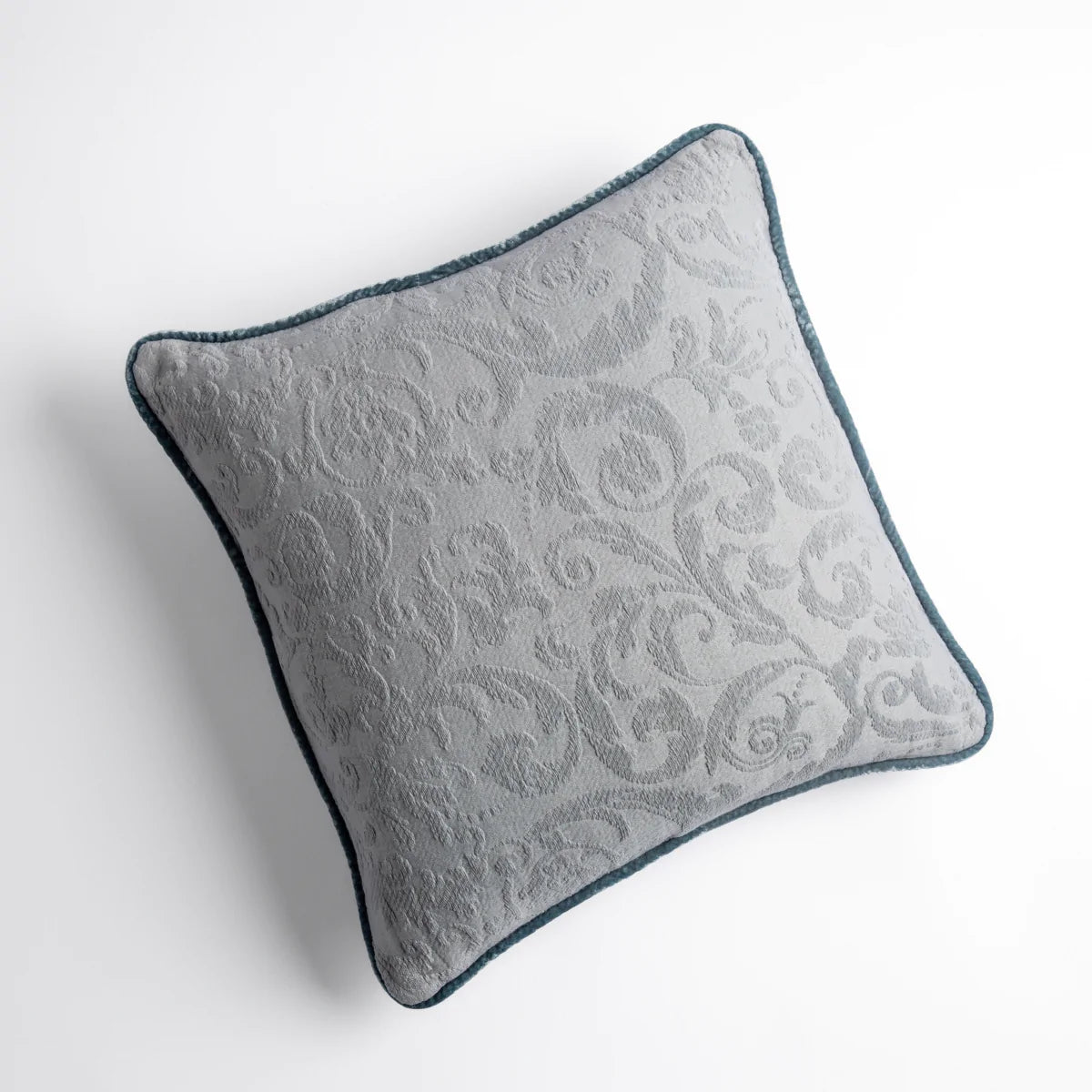 Mineral: Organic cotton damask square pillow with silk velvet trim on white background β overhead angle.