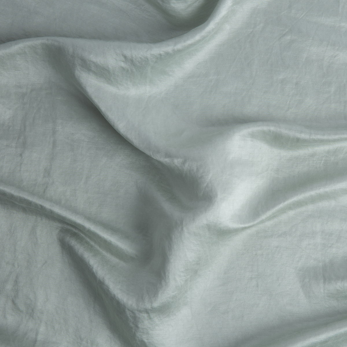 Cloud: Close-up of silk charmeuse in cloud, a soft, subtle sky blue-grey.
