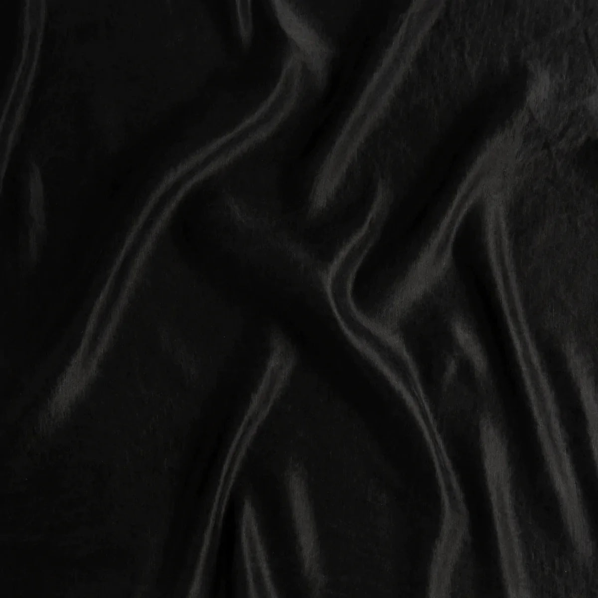 Corvino: A close up of charmeuse fabric in Corvino, a black tone