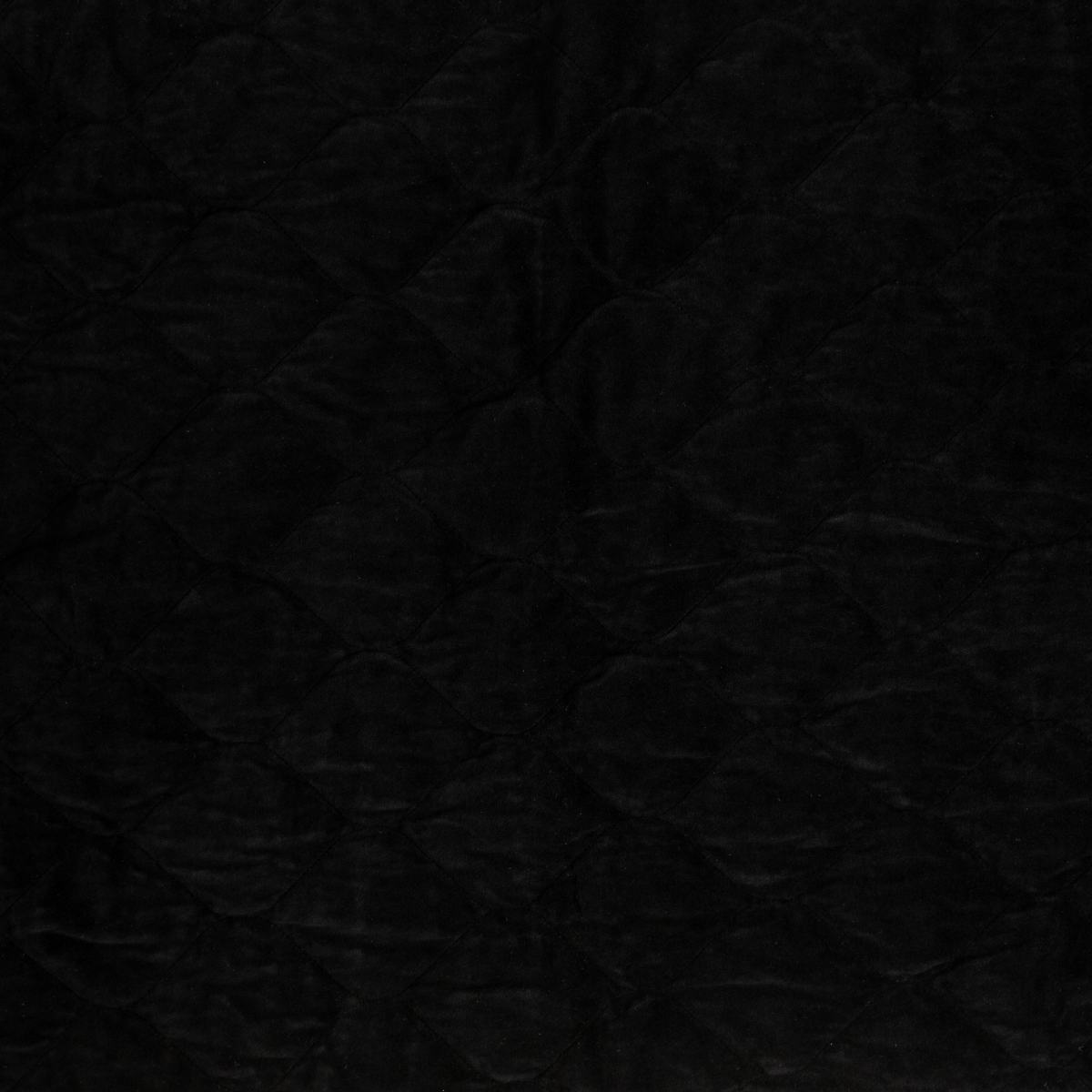 Corvino: A close up of quilted cotton velvet fabric in Corvino, a black tone