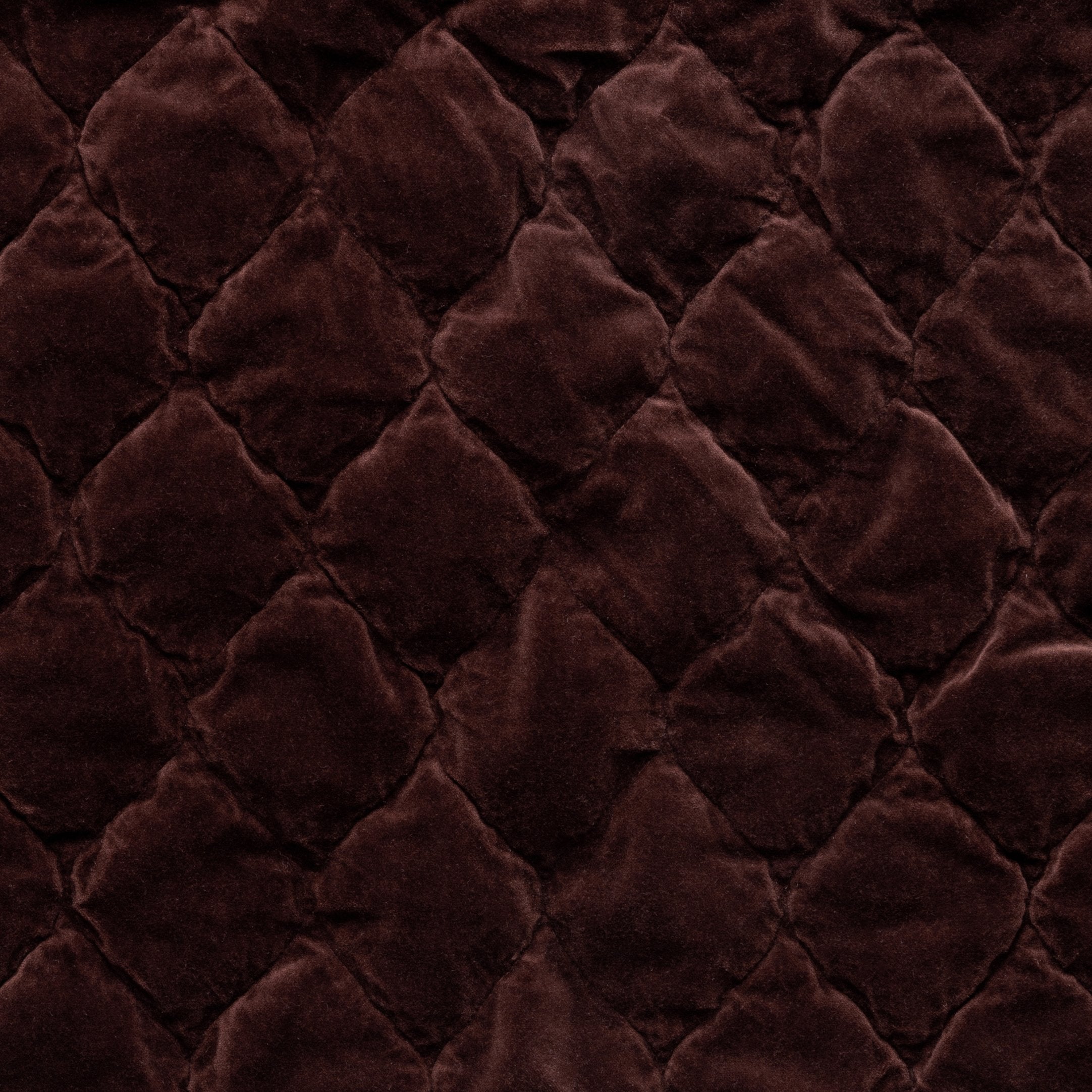 Mahogany: Close-up of Harlow cotton velvet quilting in mahogany, a deep, earthen, reddish brown.