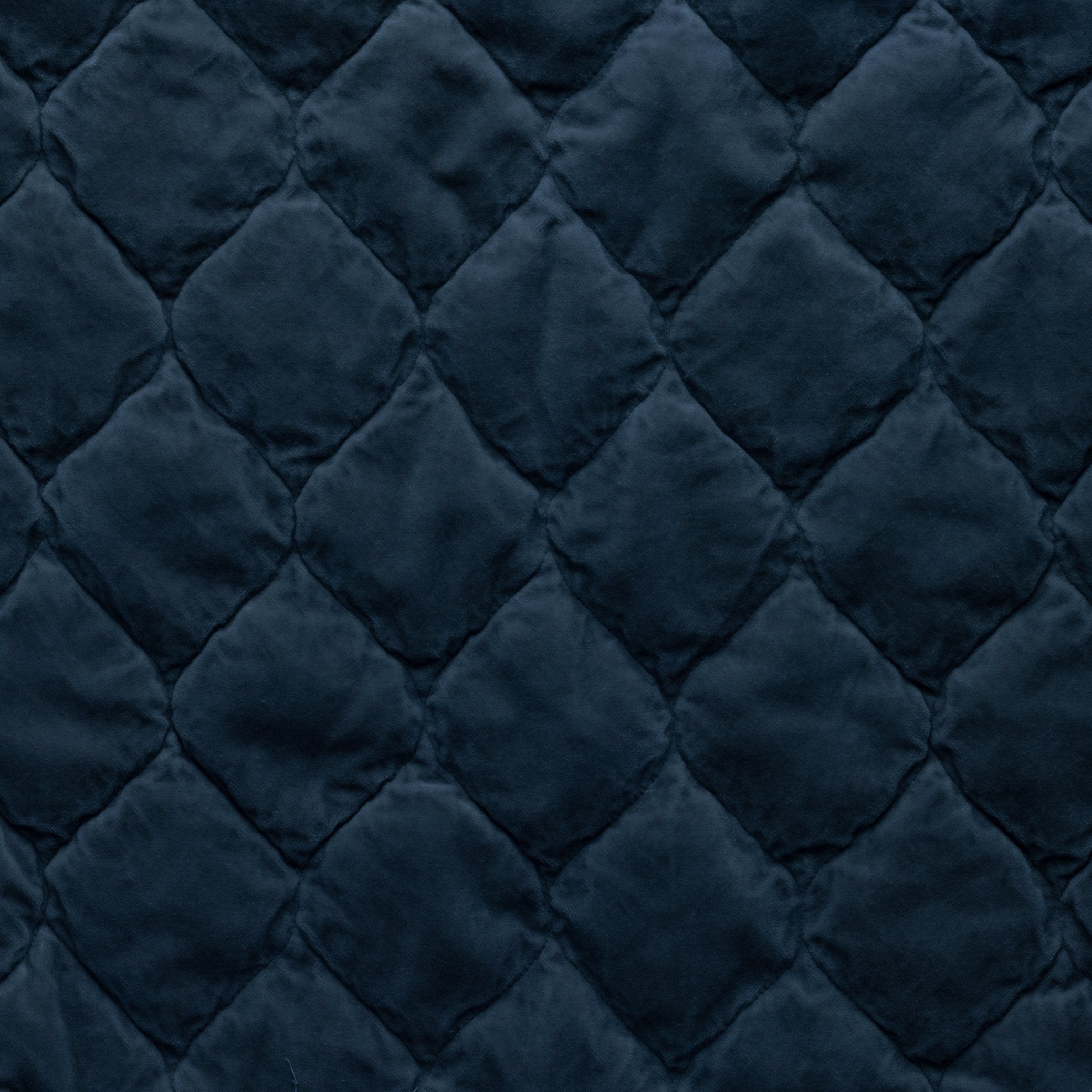 Midnight: Close-up of Harlow cotton velvet quilting in midnight, a rich indigo tone.