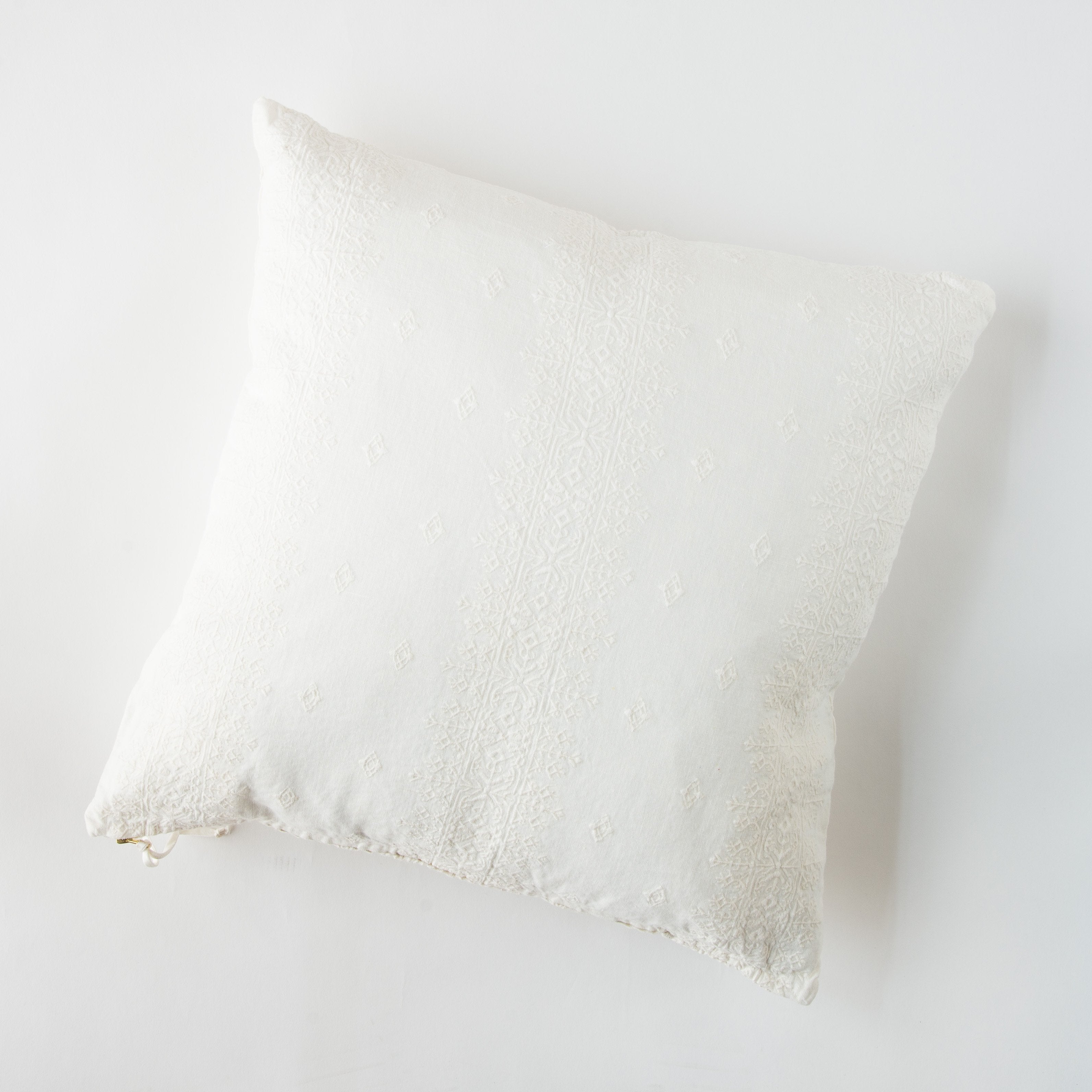 Winter White: pillow on a white background - overhead view.