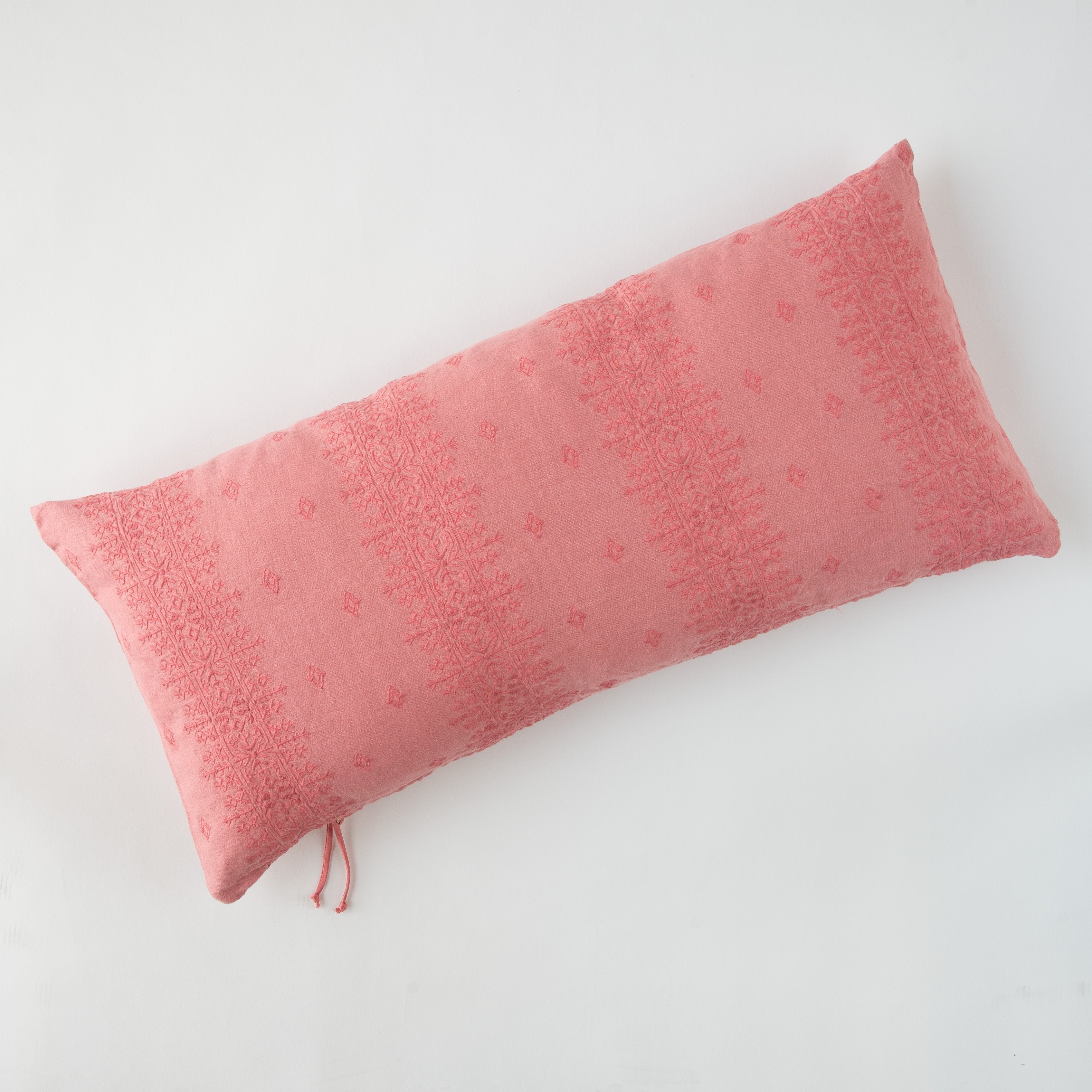 Poppy: embroidered midweight linen 16x36 pilow overhead on a white background.