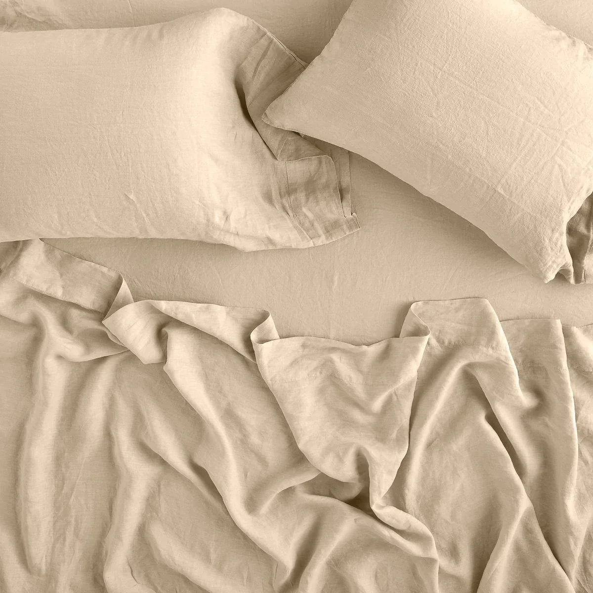 Honeycomb: fitted sheet with matching rumpled flat sheet and sleeping pillows - overhead view.