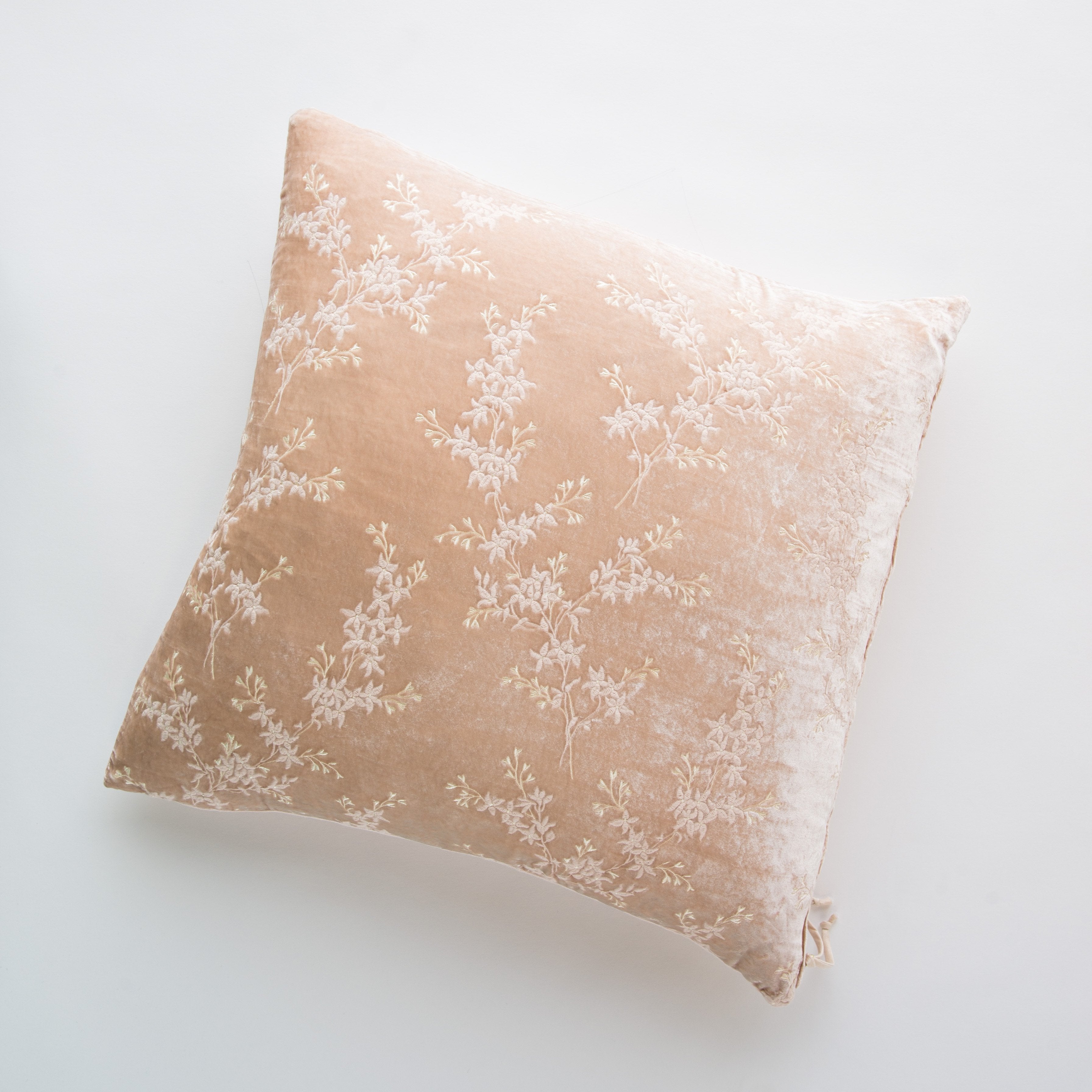 Pearl: pillow against a plain background - overhead view.
