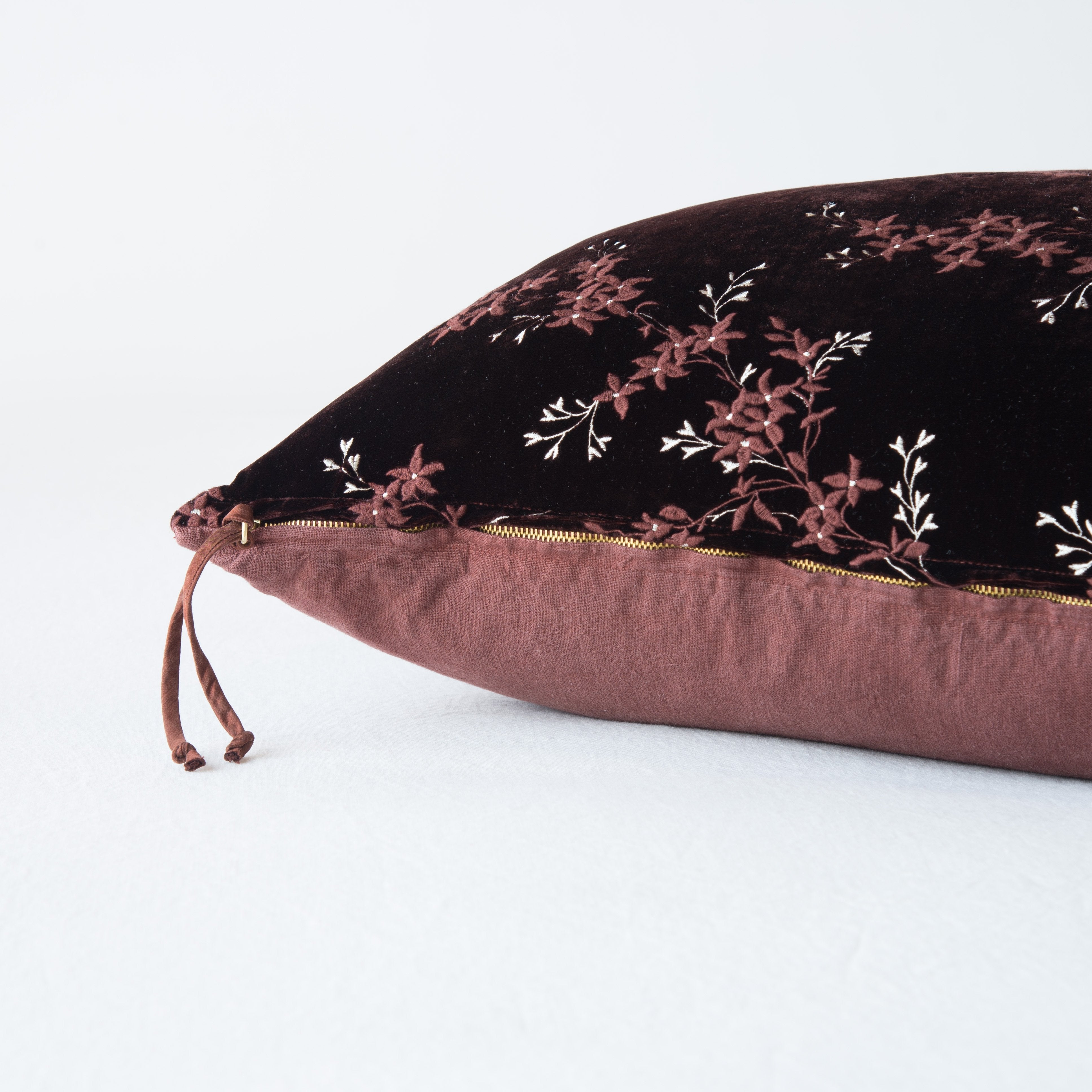 Mahogany: Close-up side vew featuring brass zipper with charmeuse pull, and linen back.