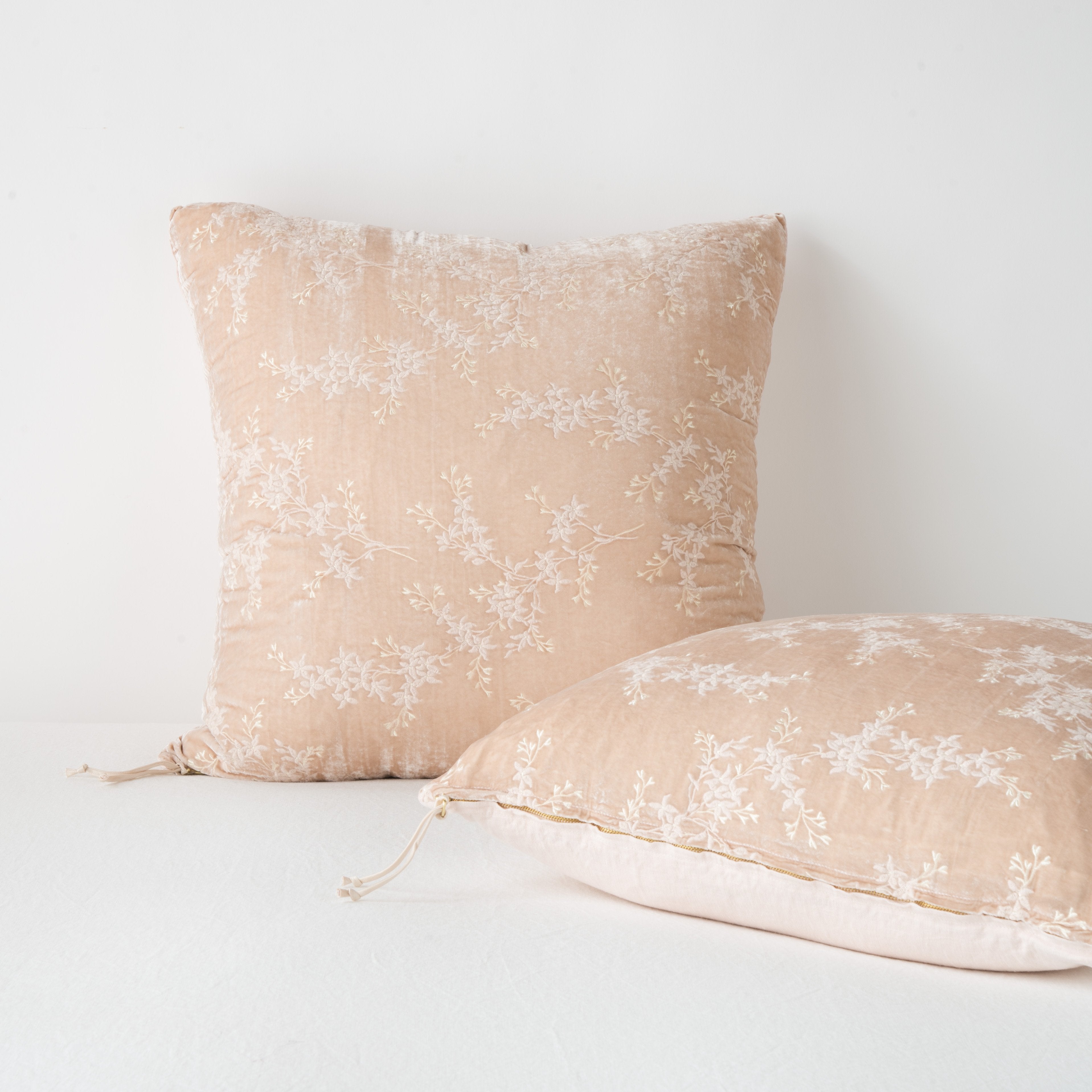 : Two Lynette shams against a light background: one upright and one laying flat, highlighting zipper detail and linen back.