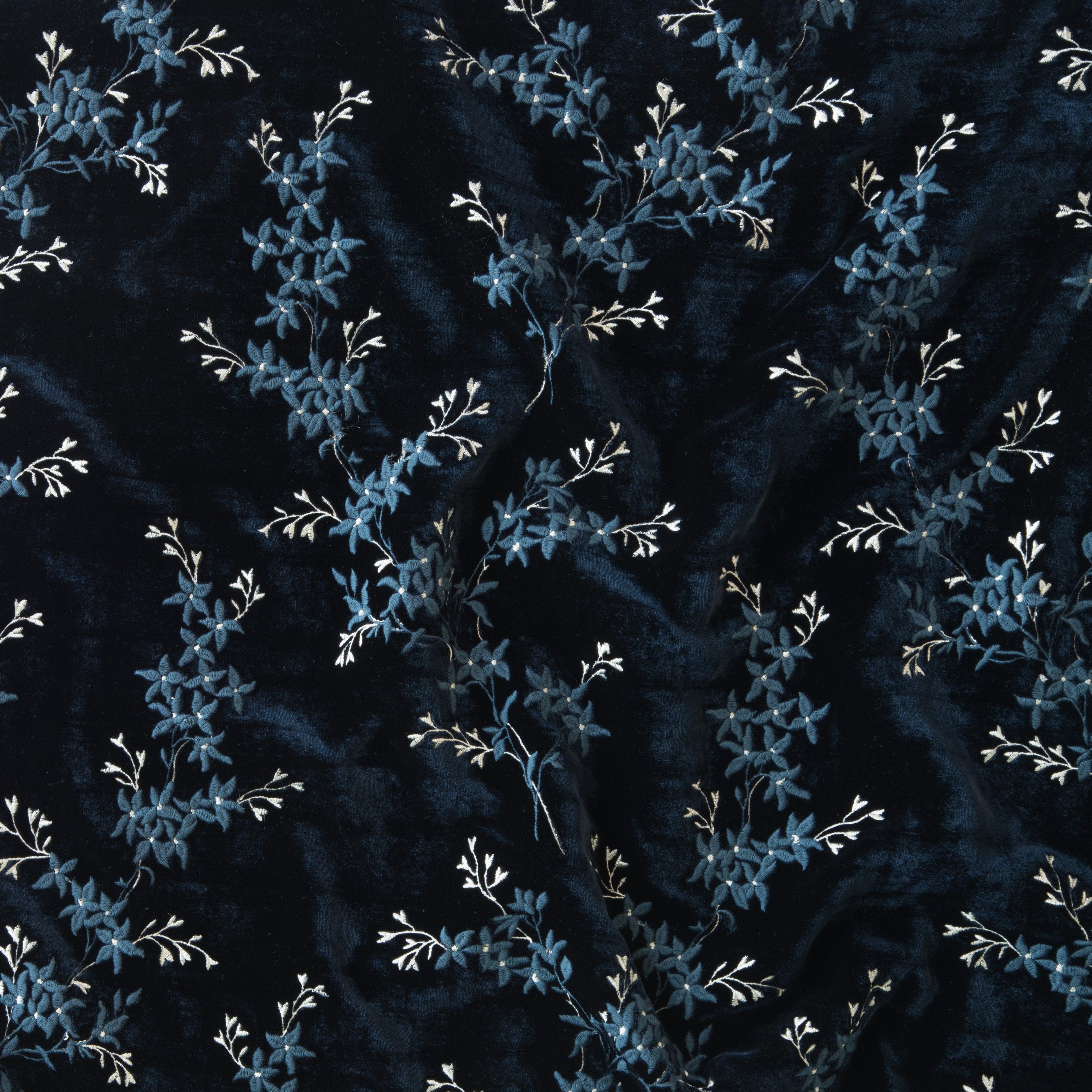 Midnight: A close up of Lynette embroidered silk velvet, in midnight, a rich indigo tone.