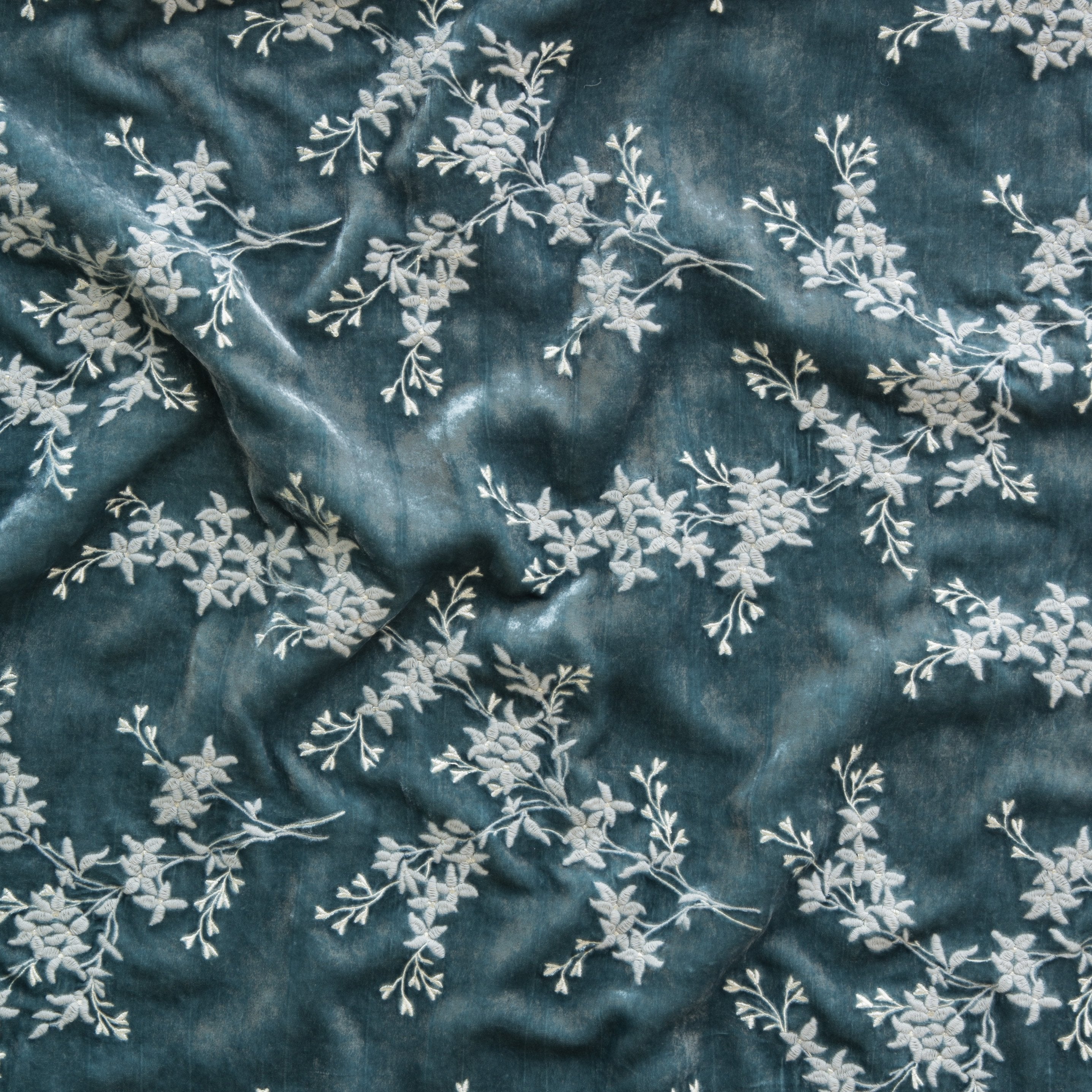 Mineral: A close up of Lynette embroidered silk velvet, in mineral, a soothing seafoam blue with subtle grey-green undertones.