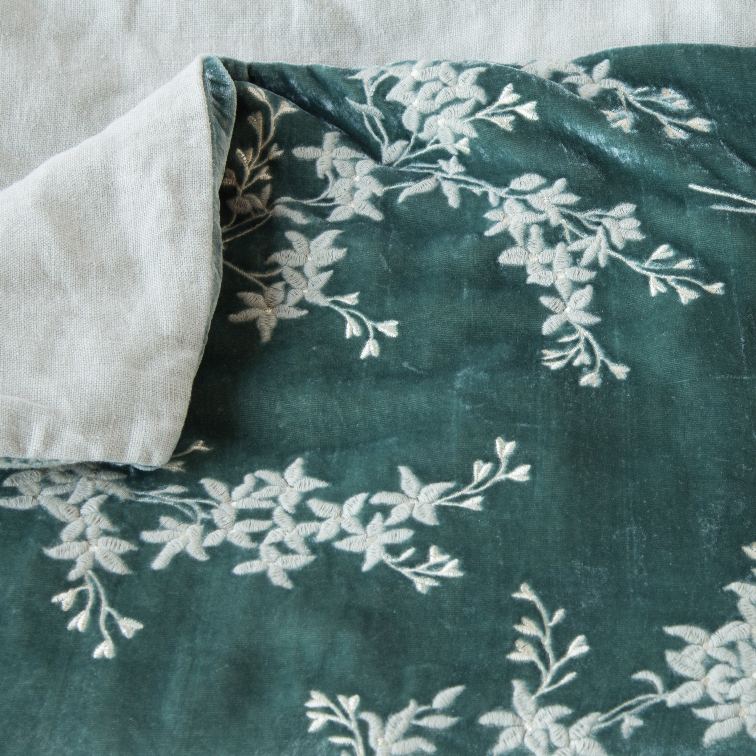 Eucalyptus: Close up of blanket, with a corner turned back to showcase the linen back - overhead view.