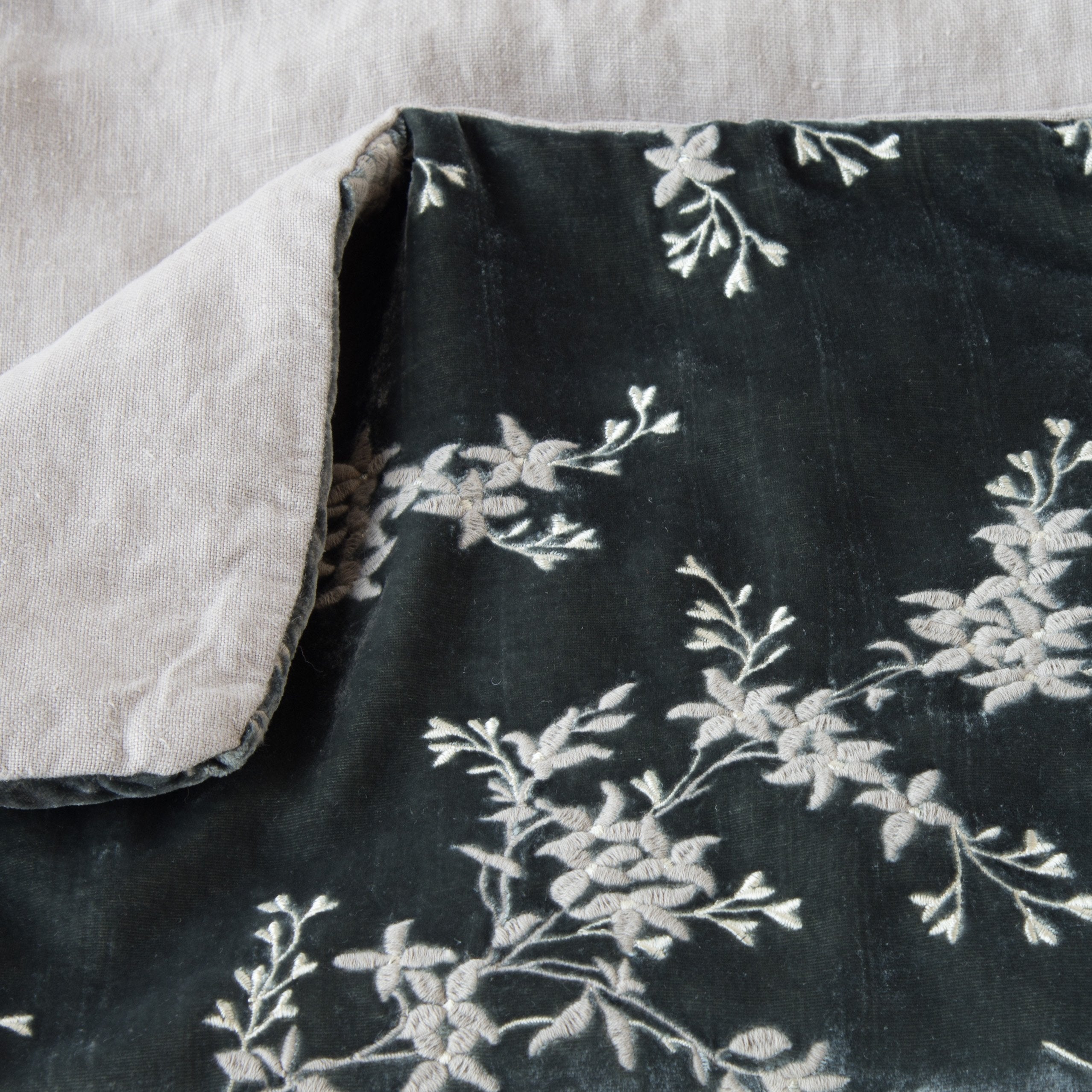 Fog: Close up of blanket, with a corner turned back to showcase the linen back - overhead view.