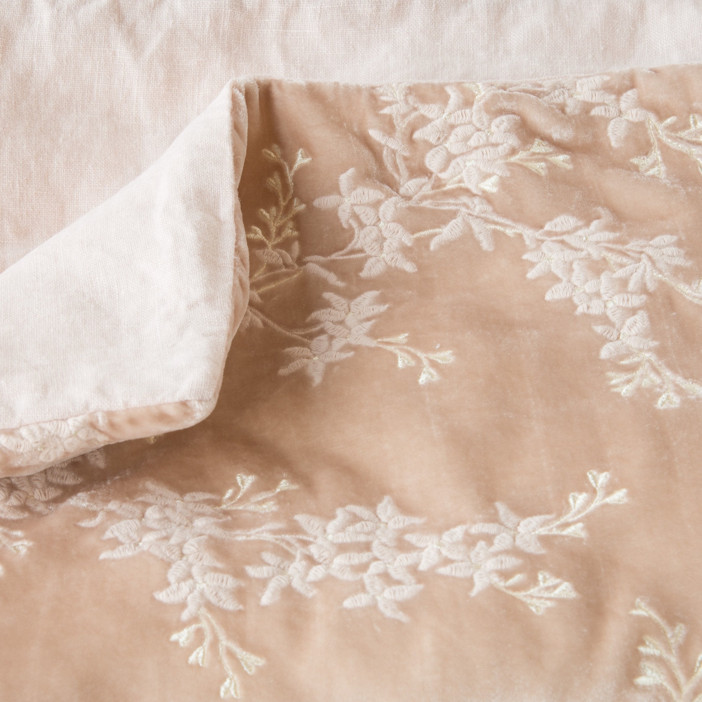 Pearl: Close up of blanket, with a corner turned back to showcase the linen back - overhead view.